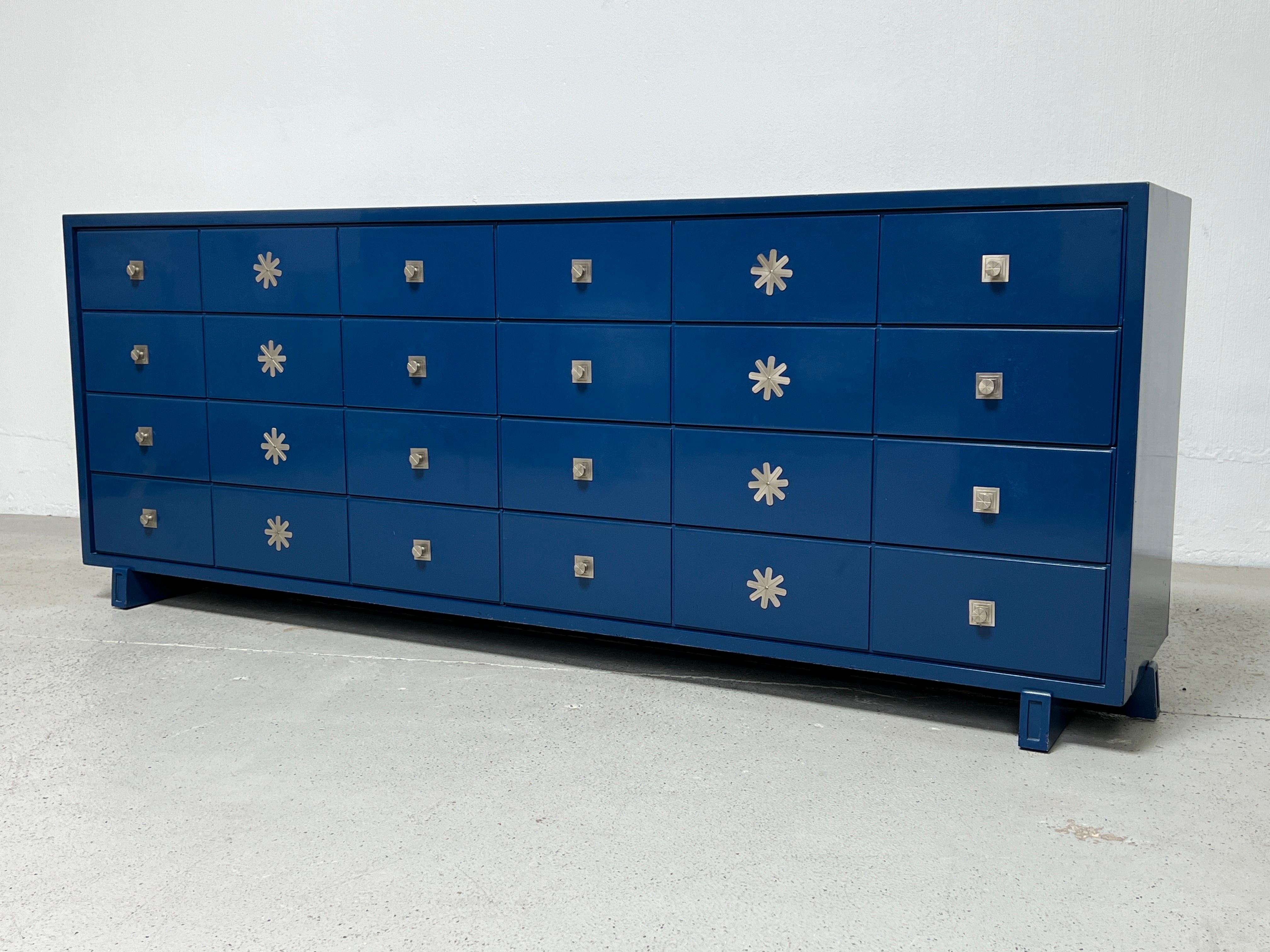 A large eight drawer dresser in original blue lacquer by Tommi Parzinger for Parzinger Originals.