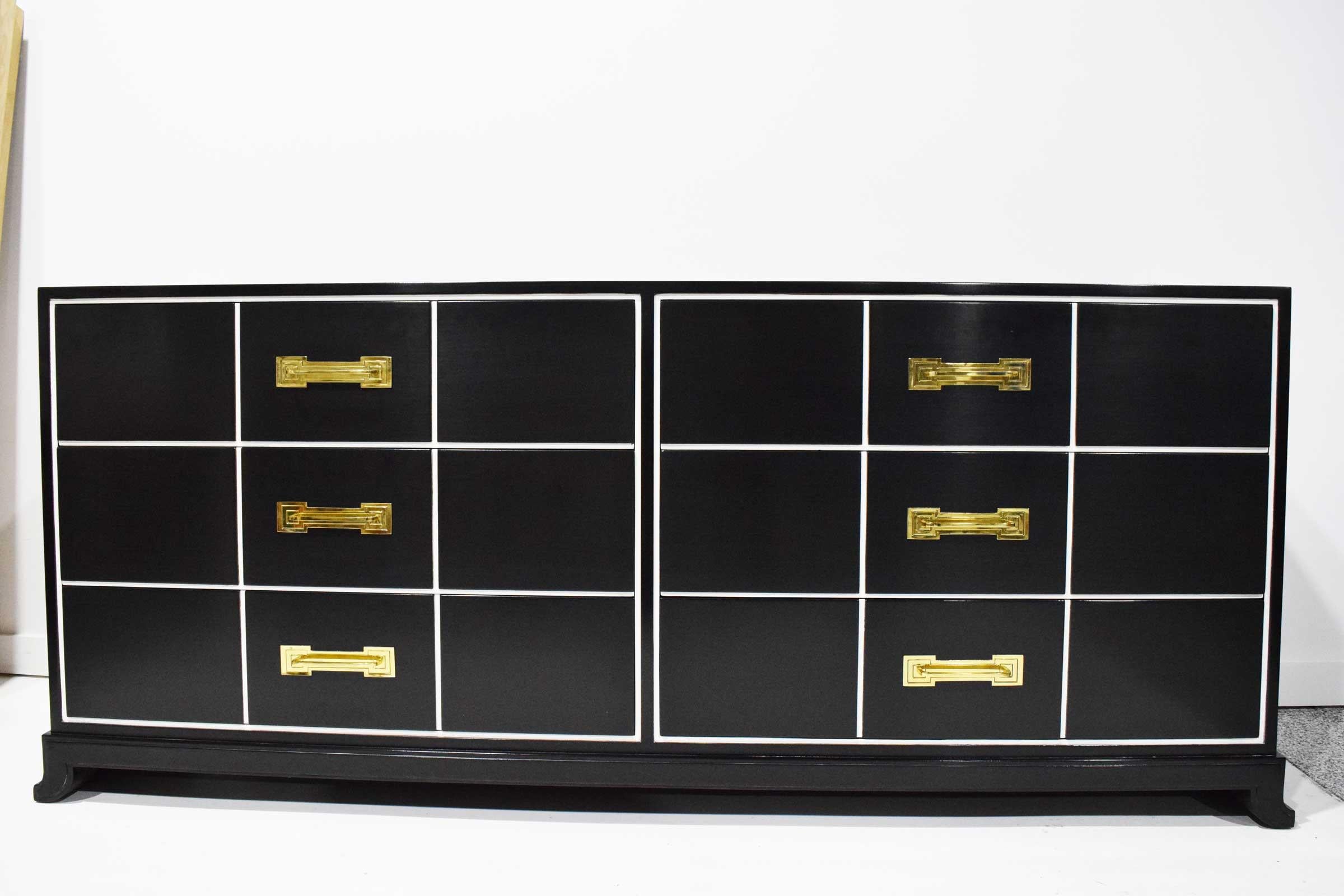 Six-drawer chest, designed by Tommi Parzinger, circa 1948. Produced in Boston, Massachusetts by Charak Furniture Company. Charak, was at one point, one of the finest furniture makers in the country. This cabinet is lacquered in high gloss black with