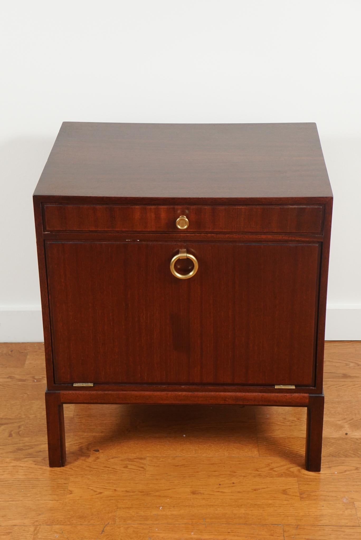 Designed by Tommi Parzinger, for Charak Modern (signed)
This charming mahogany nightstand has one narrow drawer and a drop front storage area.
