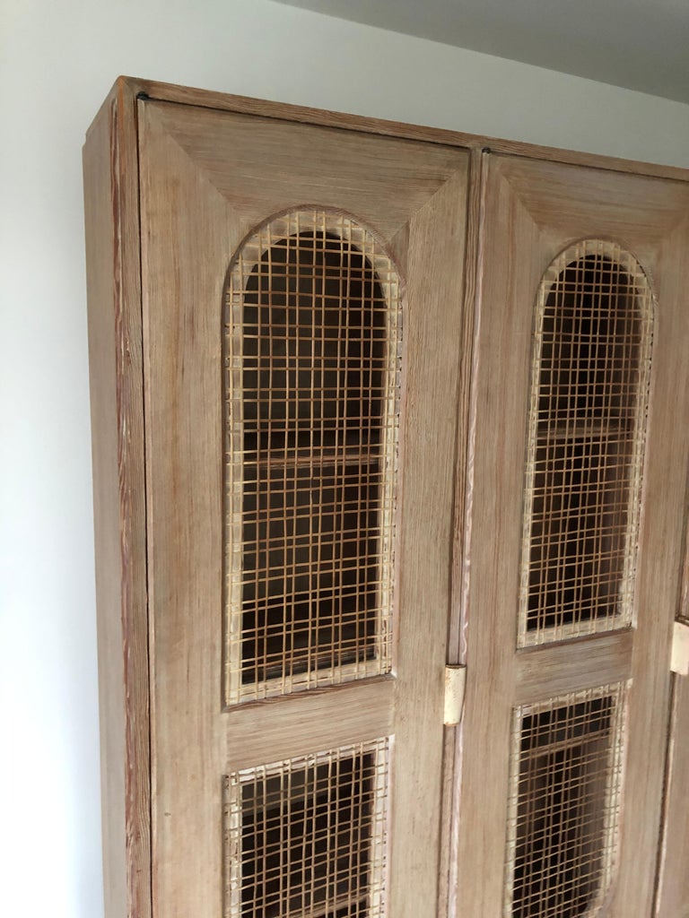 Tommi Parzinger Early Important Tall Bookcase Limed Sawed Oak Cane Door For Sale at 1stDibs