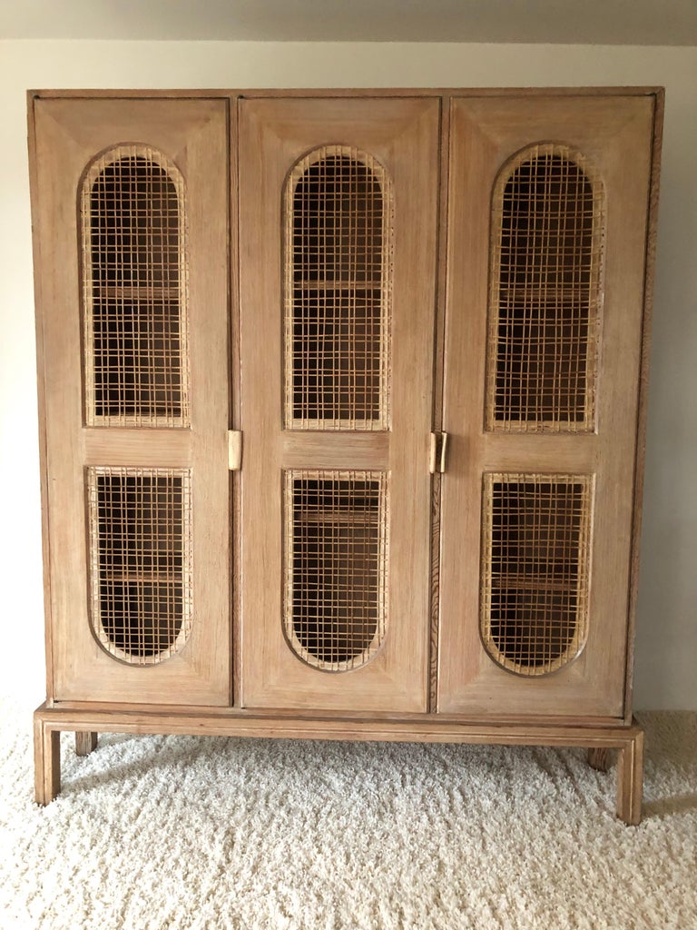Tommi Parzinger Early Important Tall Bookcase Limed Sawed Oak Cane Door For Sale at 1stDibs