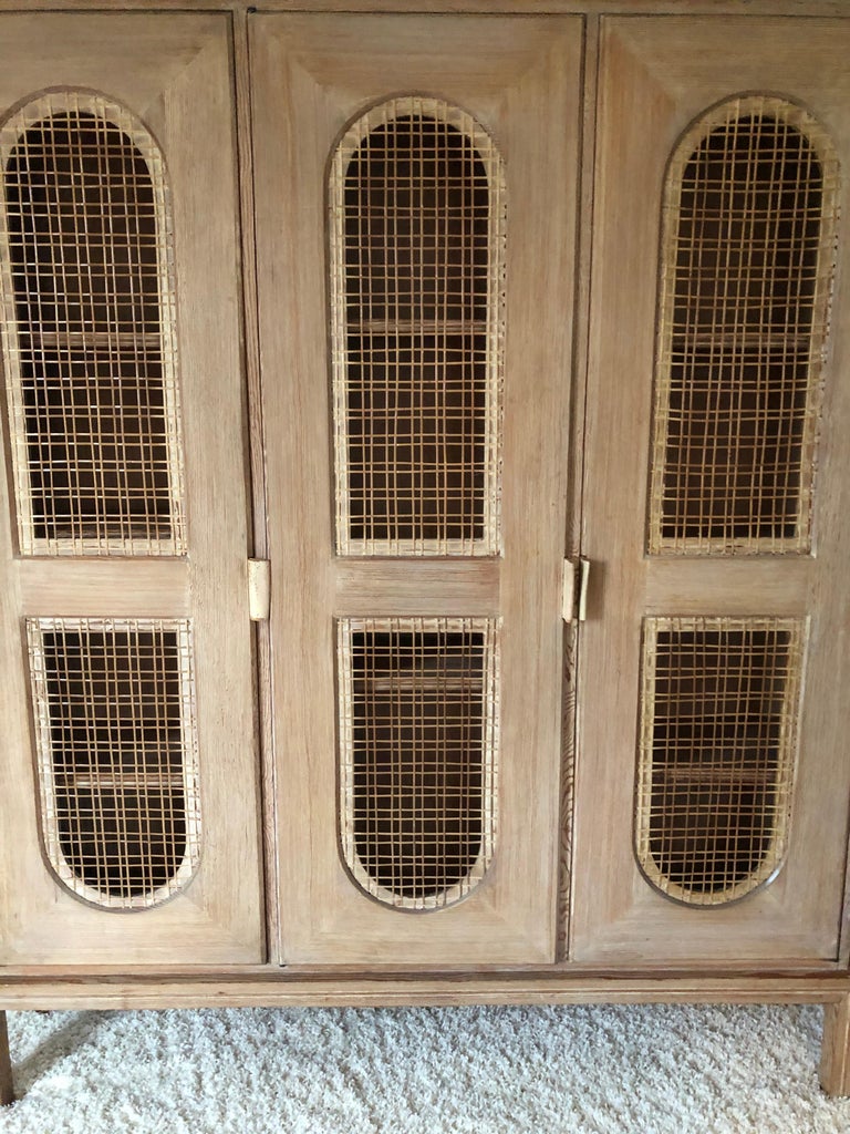 Tommi Parzinger Early Important Tall Bookcase Limed Sawed Oak Cane Door For Sale at 1stDibs