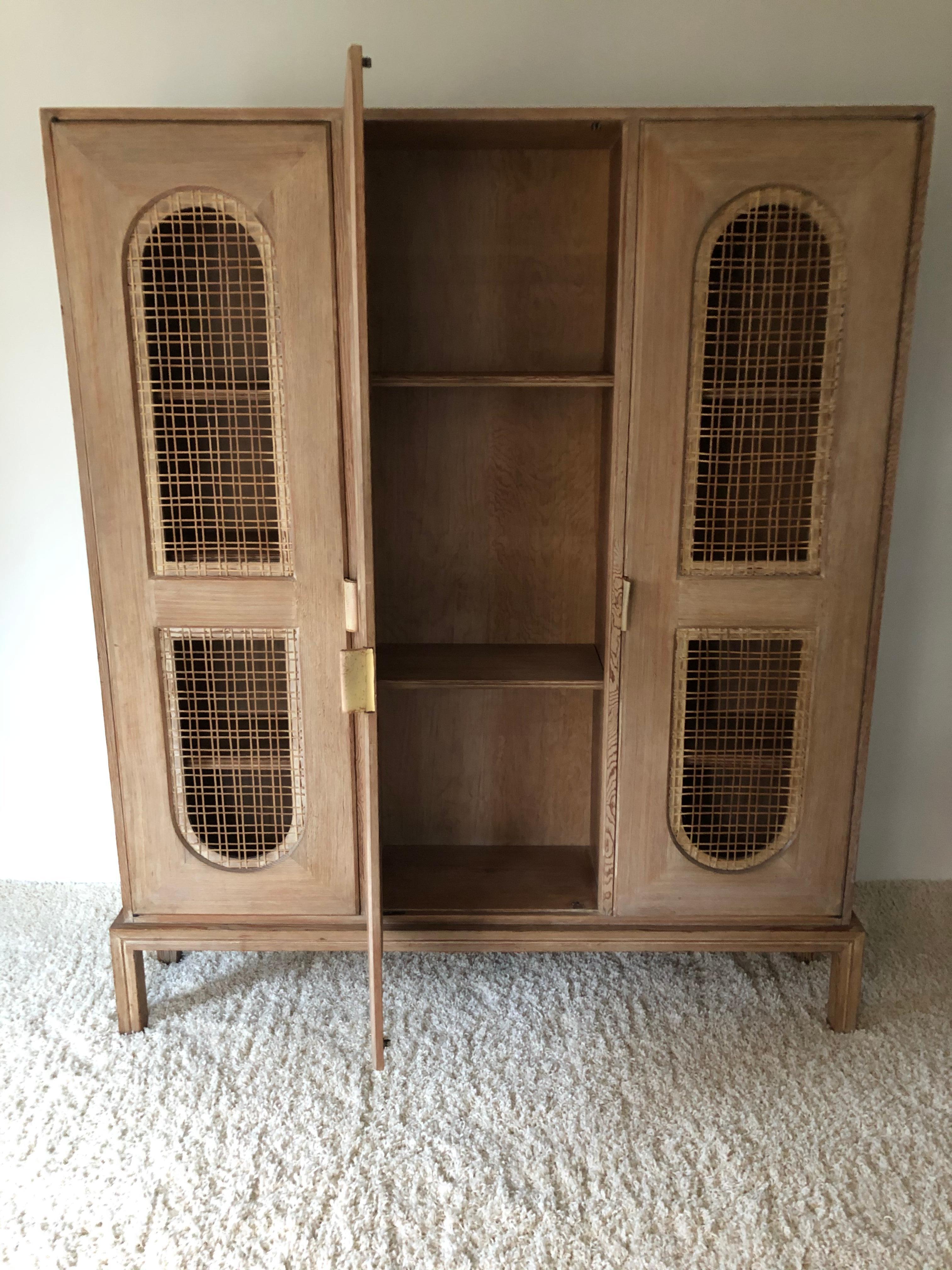 Tommi Parzinger Early Important Tall Cabinet/ Bookcase Limed Sawed Oak Cane Door In Good Condition For Sale In Westport, CT