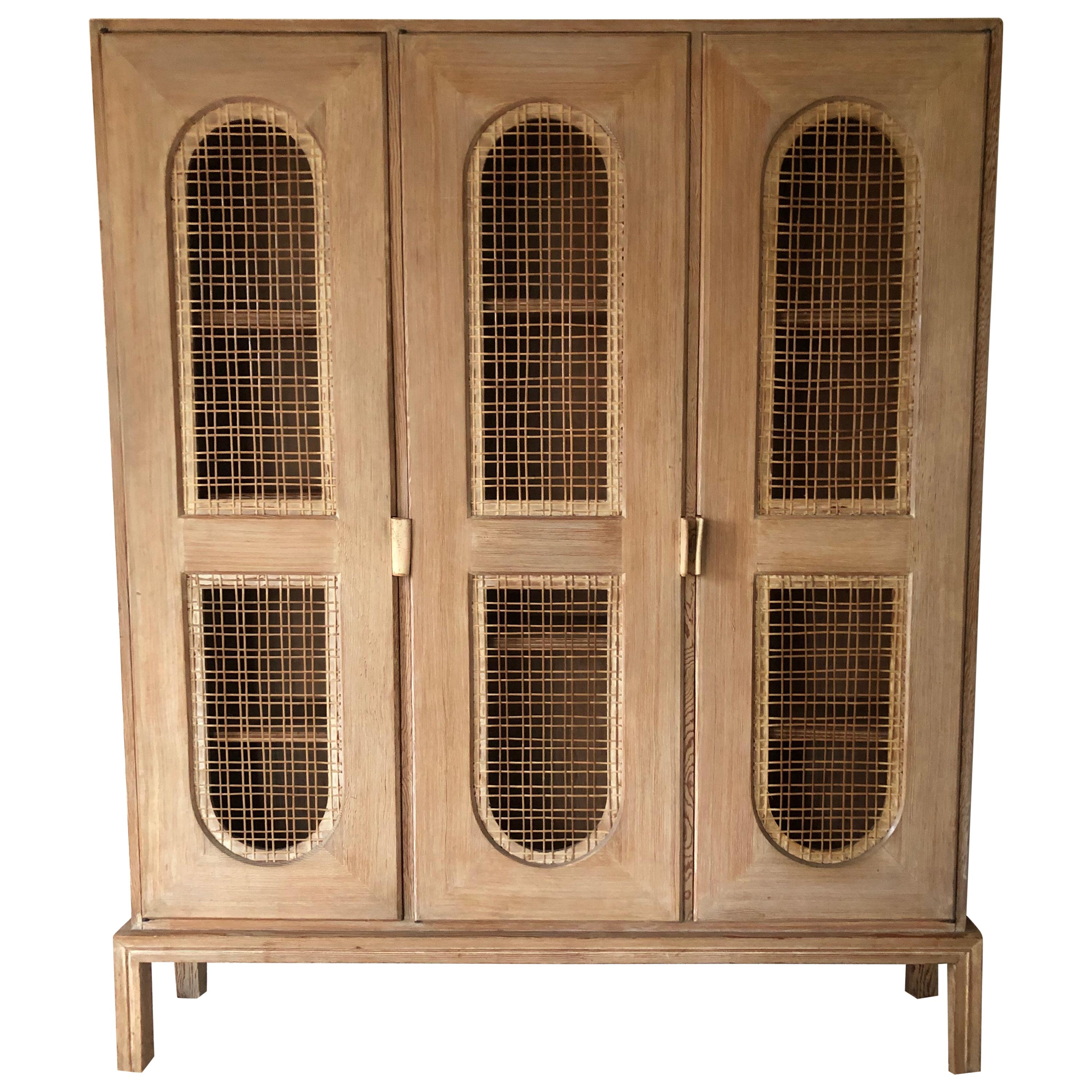 Tommi Parzinger Early Important Tall Cabinet/ Bookcase Limed Sawed Oak Cane Door For Sale