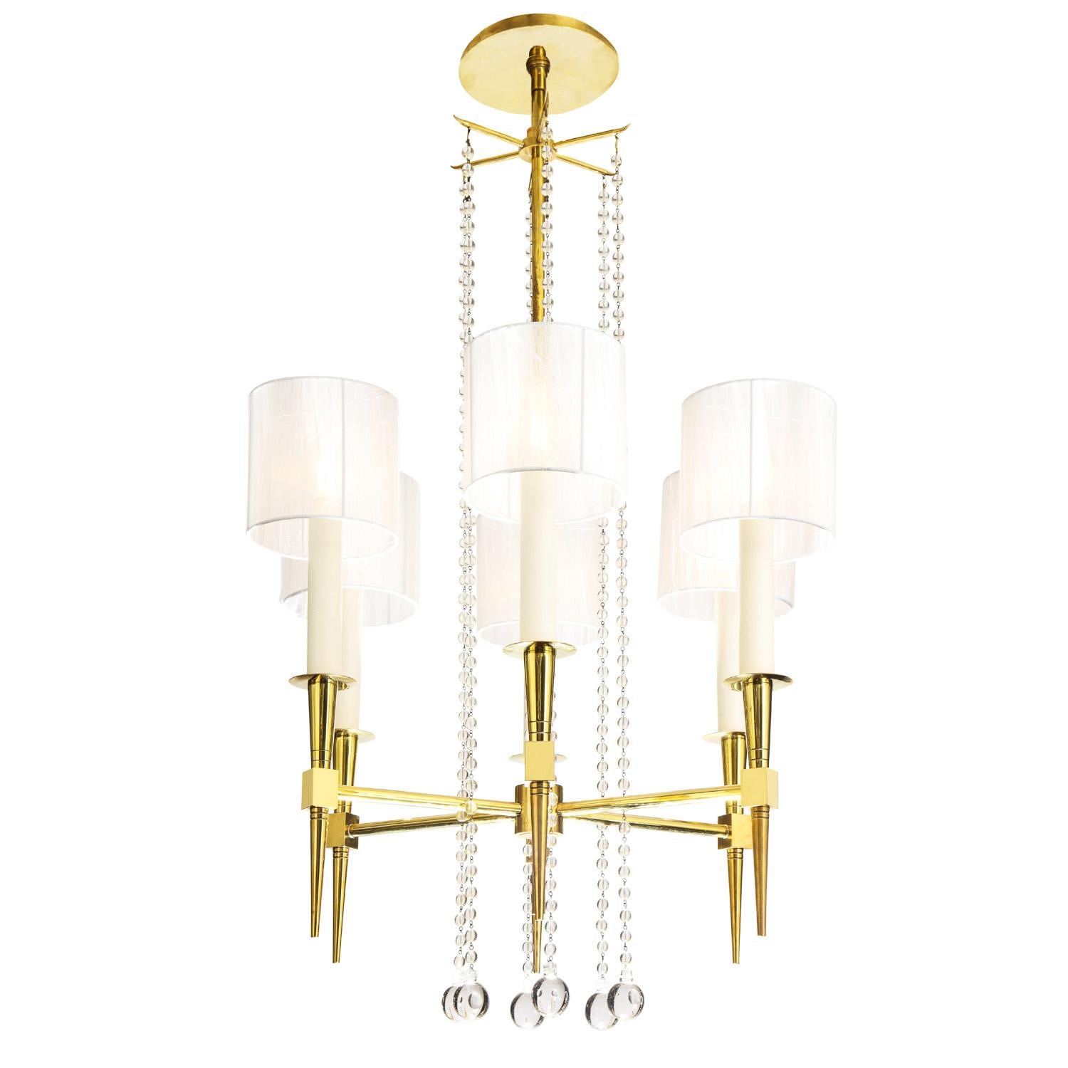 Beautifully crafted 6 arm chandelier model no 1 in brass with suspended crystal beads by Tommi Parzinger for Parzinger Originals, American 1950's. This chandelier is the epidemy of elegance and is an iconic Parzinger design.

Reference:
Parzinger