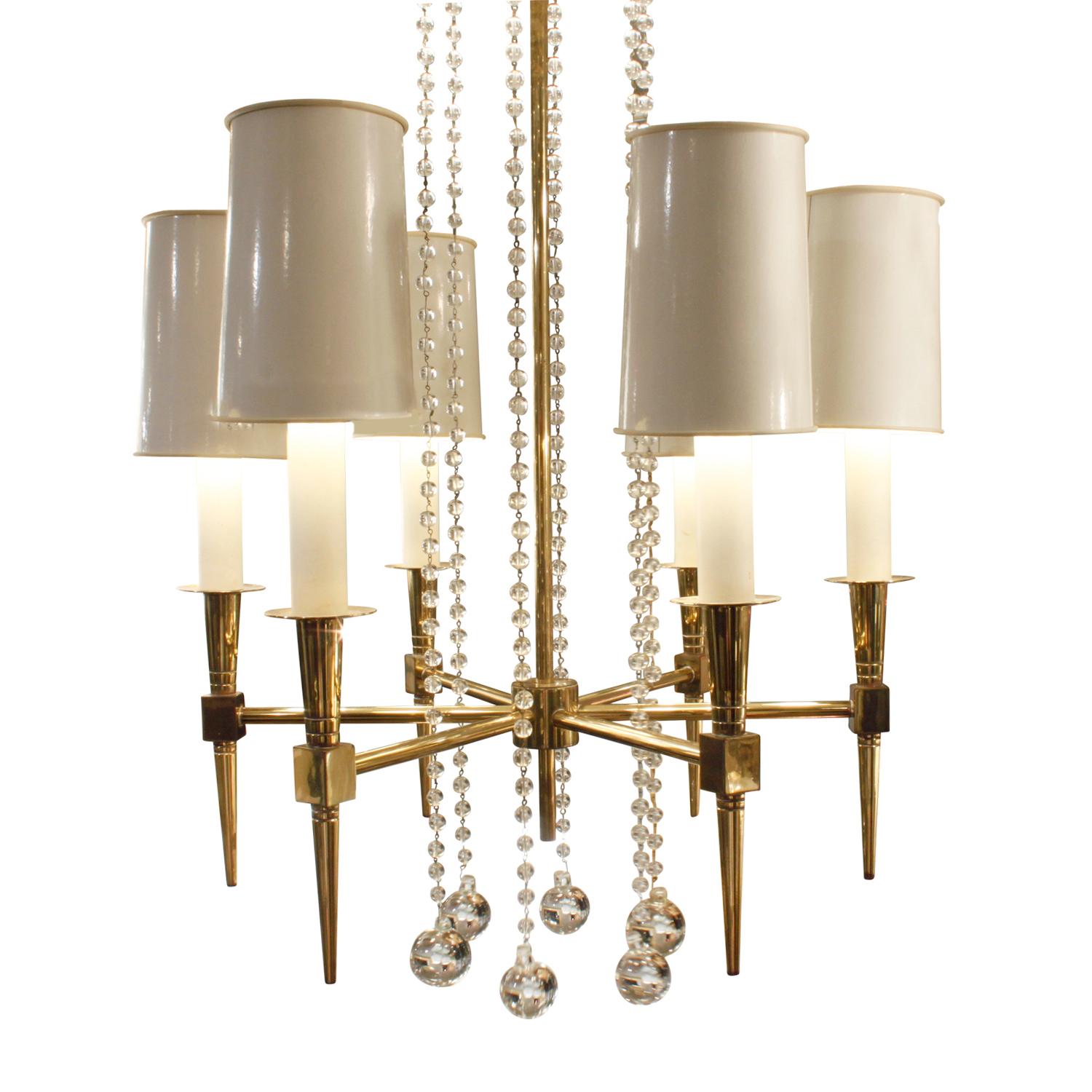 Elegant 6-arm chandelier model no 1 in brass with suspended crystal beads by Tommi Parzinger for Parzinger Originals, American 1950s. This is an iconic Tommi Parzinger chandelier.
