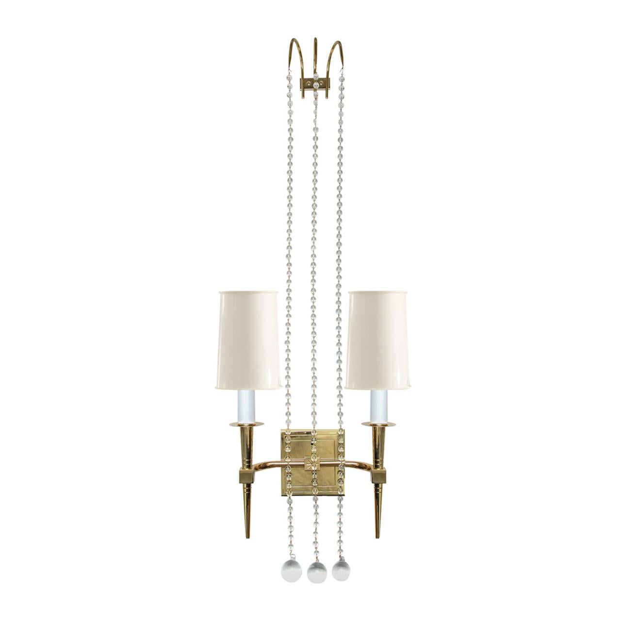 Pair of sconces model no 12 in brass with suspended crystals by Tommi Parzinger for Parzinger Originals, American, 1950s. These are beautifully made and very elegant.