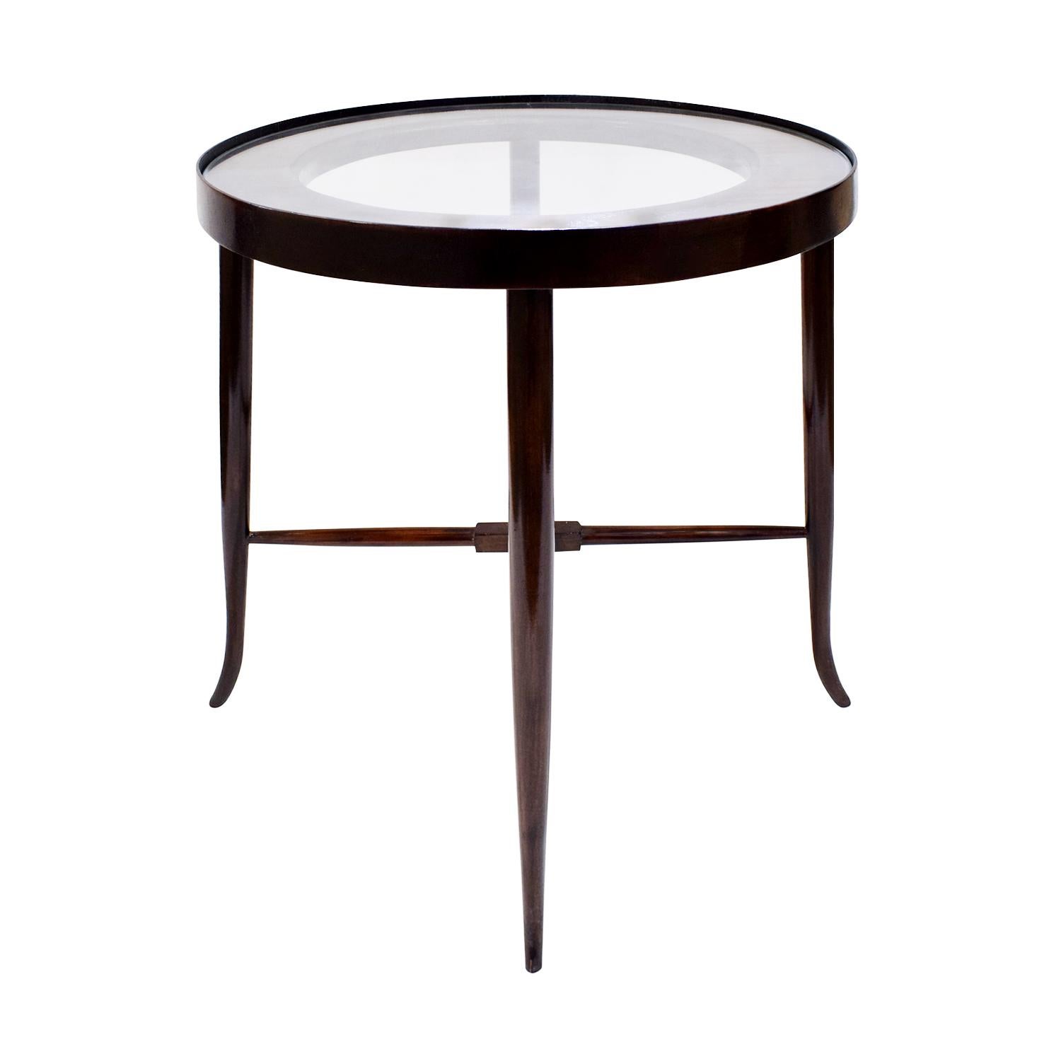 Rare side table with tapering legs in mahogany and walnut top and inset glass by Tommi Parzinger for Parzinger originals, American 1950s. This table exemplifies the elegance that Tommi Parzinger was known for.