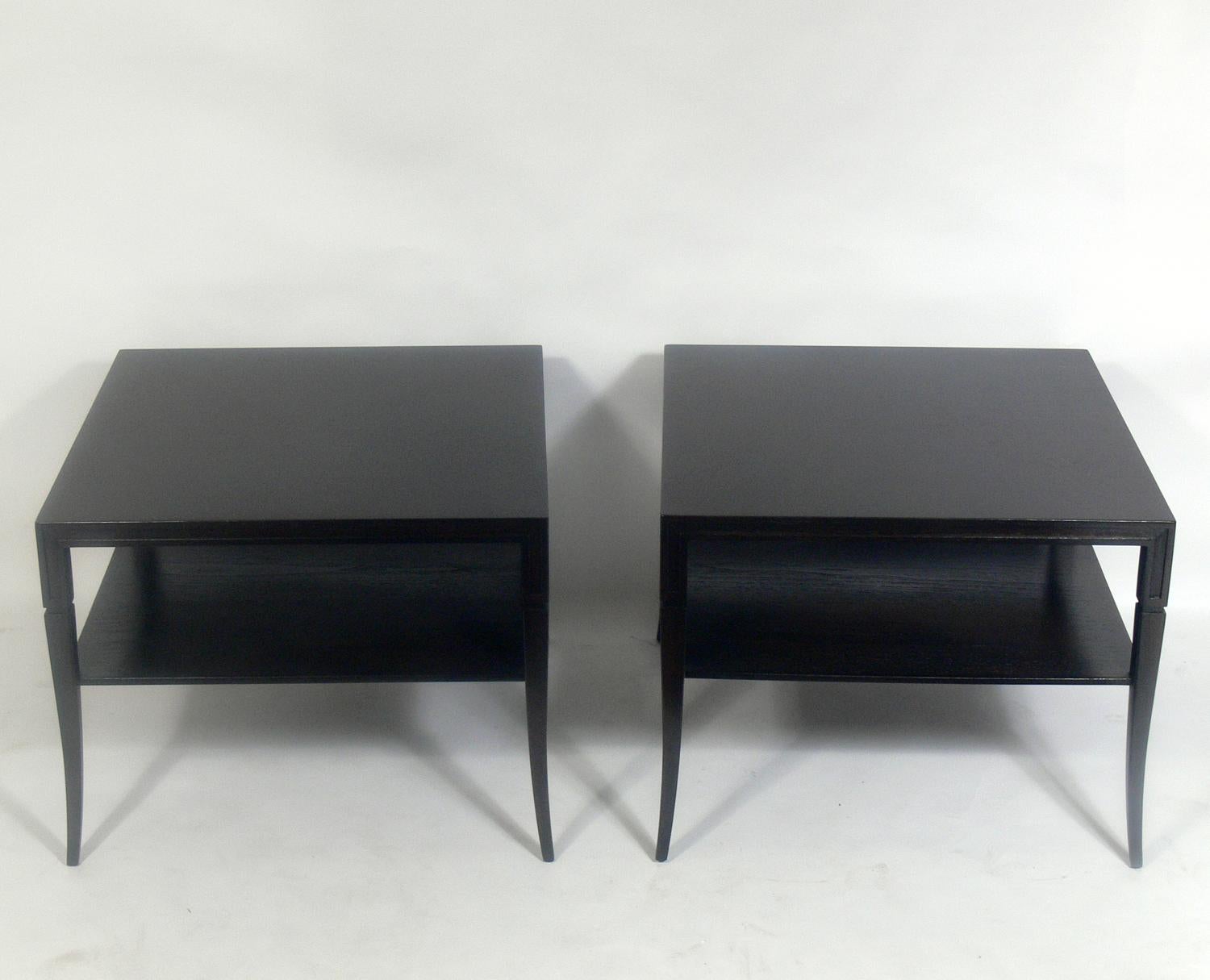 Pair of glamorous end tables, designed by Tommi Parzinger for Parzinger originals, American, circa 1950s. Signed with Parzinger originals label underneath. They have been refinished in an ultra-deep brown color lacquer. They are a versatile size and