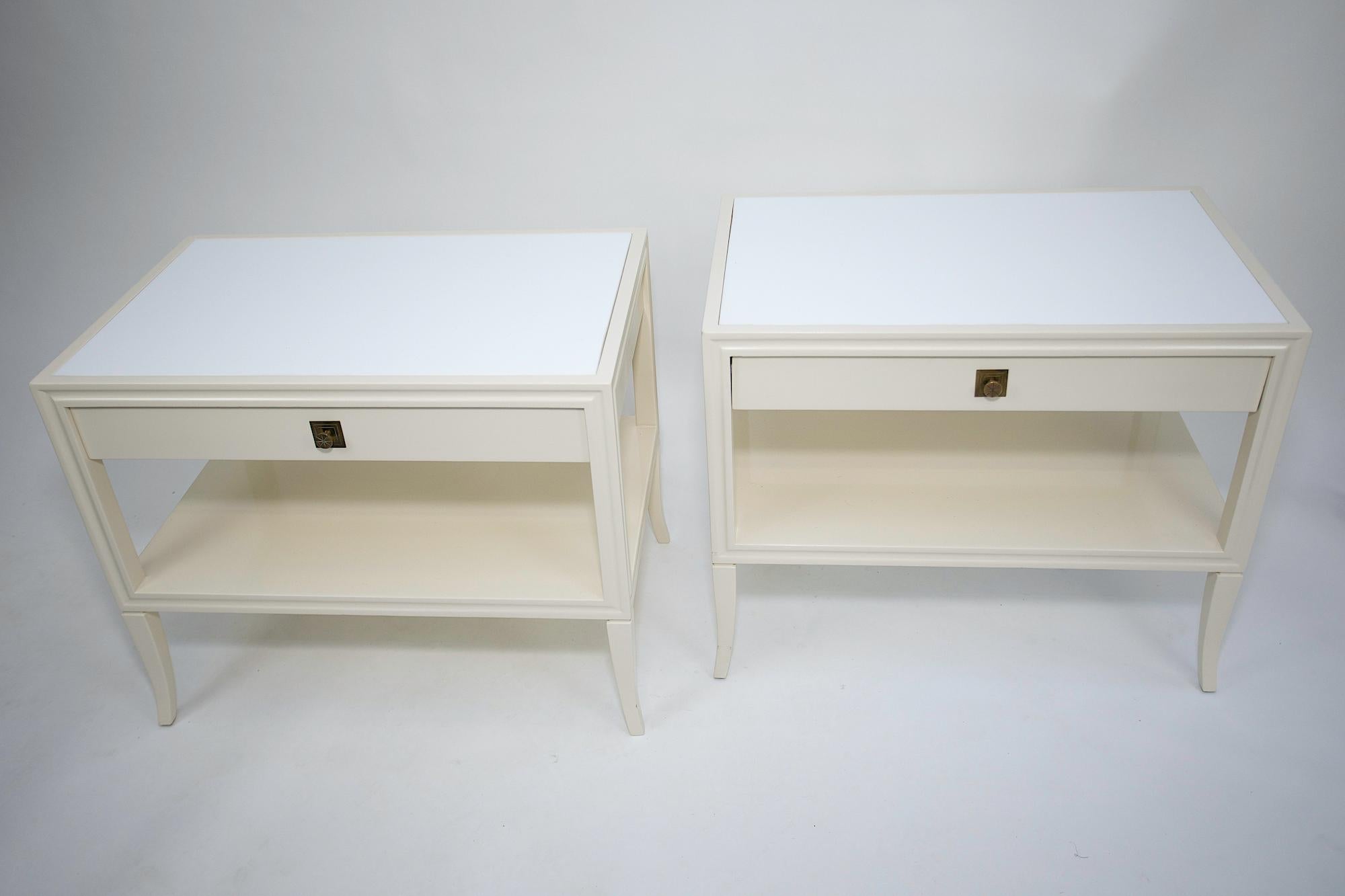 A pair of Tommi Parzinger End Tables for Parzinger Originals.
Lacquered wood Architectural white glass tops and Brass engraved Drawer Pulls.
Refinished and Re-Glazed original surface.