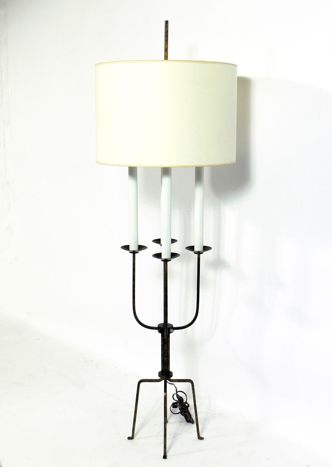 Elegant floor lamp, designed by Tommi Parzinger, American, circa 1950s. It retains it's original gold patinated finish with warm original patina. It has been rewired and is ready to use.