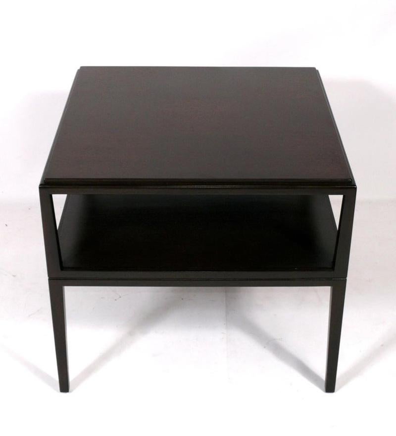 Large scale end or side tables, designed by Tommi Parzinger for Charak Modern, American, circa 1950s. These are a versatile size and can be used as side or end tables, or as night stands. They have been newly refinished in an ultra deep brown color. 