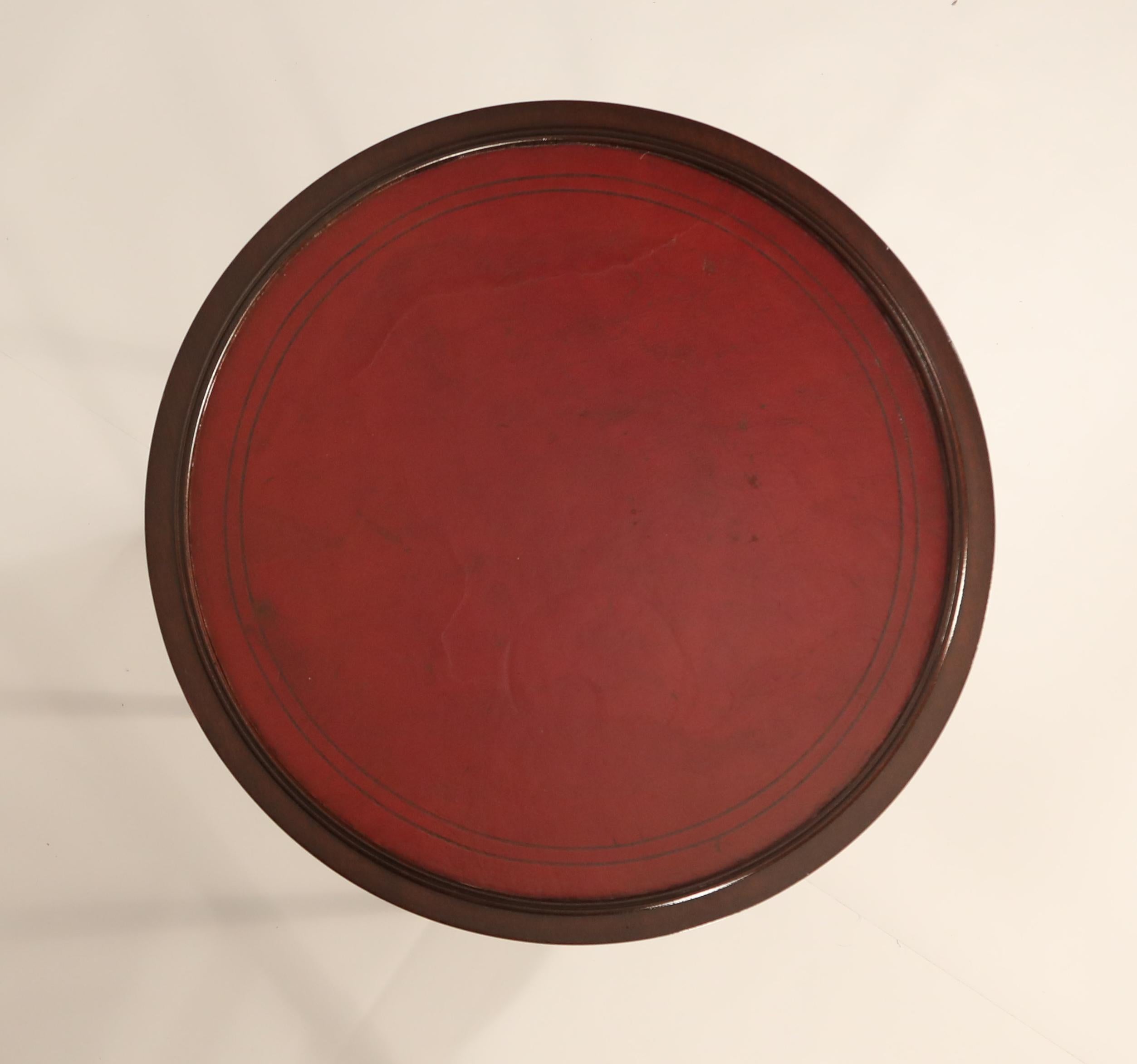 This rare Tommi Parzinger mahogany side table has been fully refinished and is incredibly gorgeous with rich wood grain. Featuring a lower shelf and a leather top with beautiful patina and vibrant color. Signed underneath with original Charak Modern