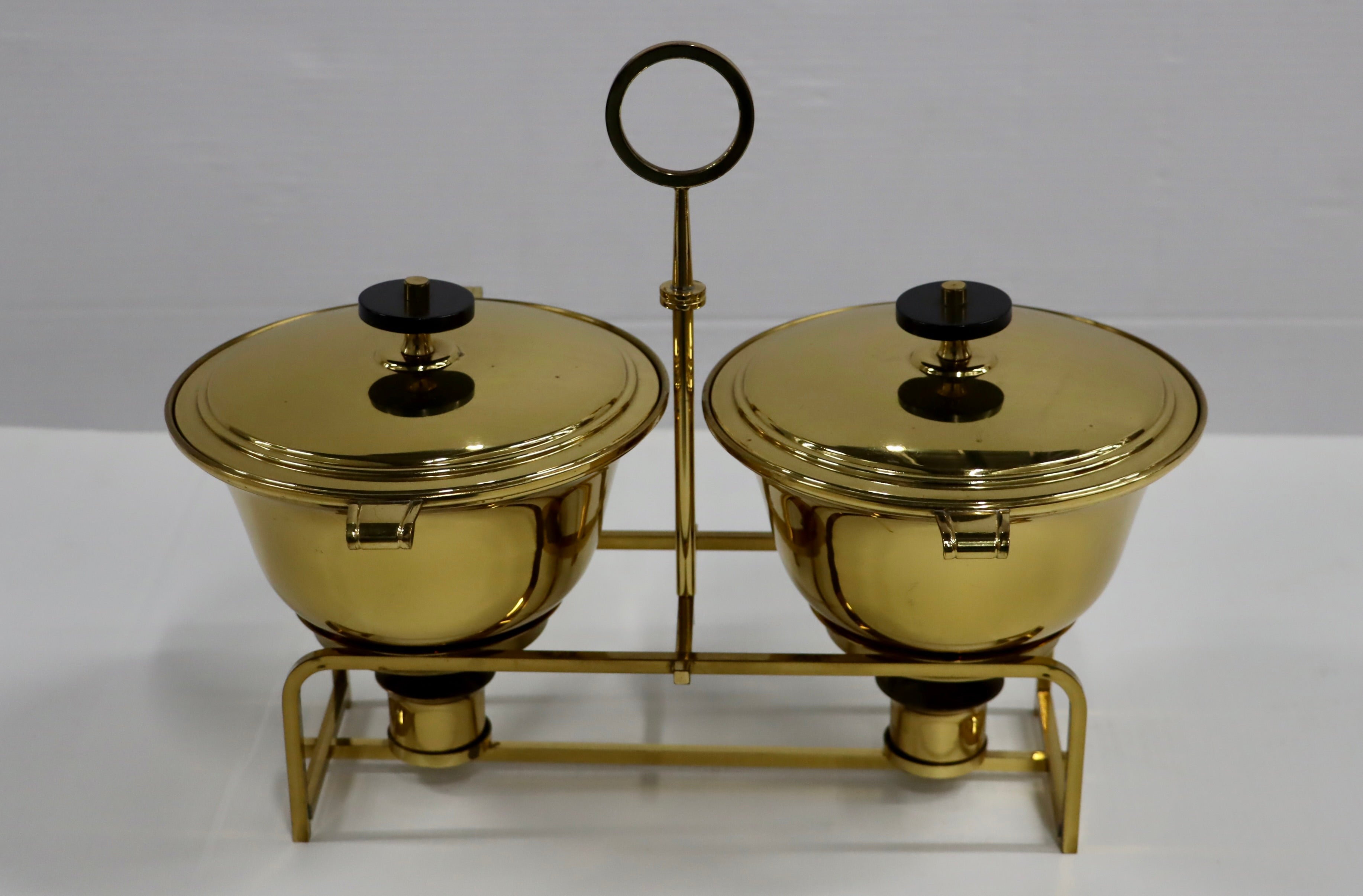 1950's brass double chafing designed by Tommi Parzinger for Dorlyn Silversmiths, in vintage original condition with some wear and patina due to age and use.