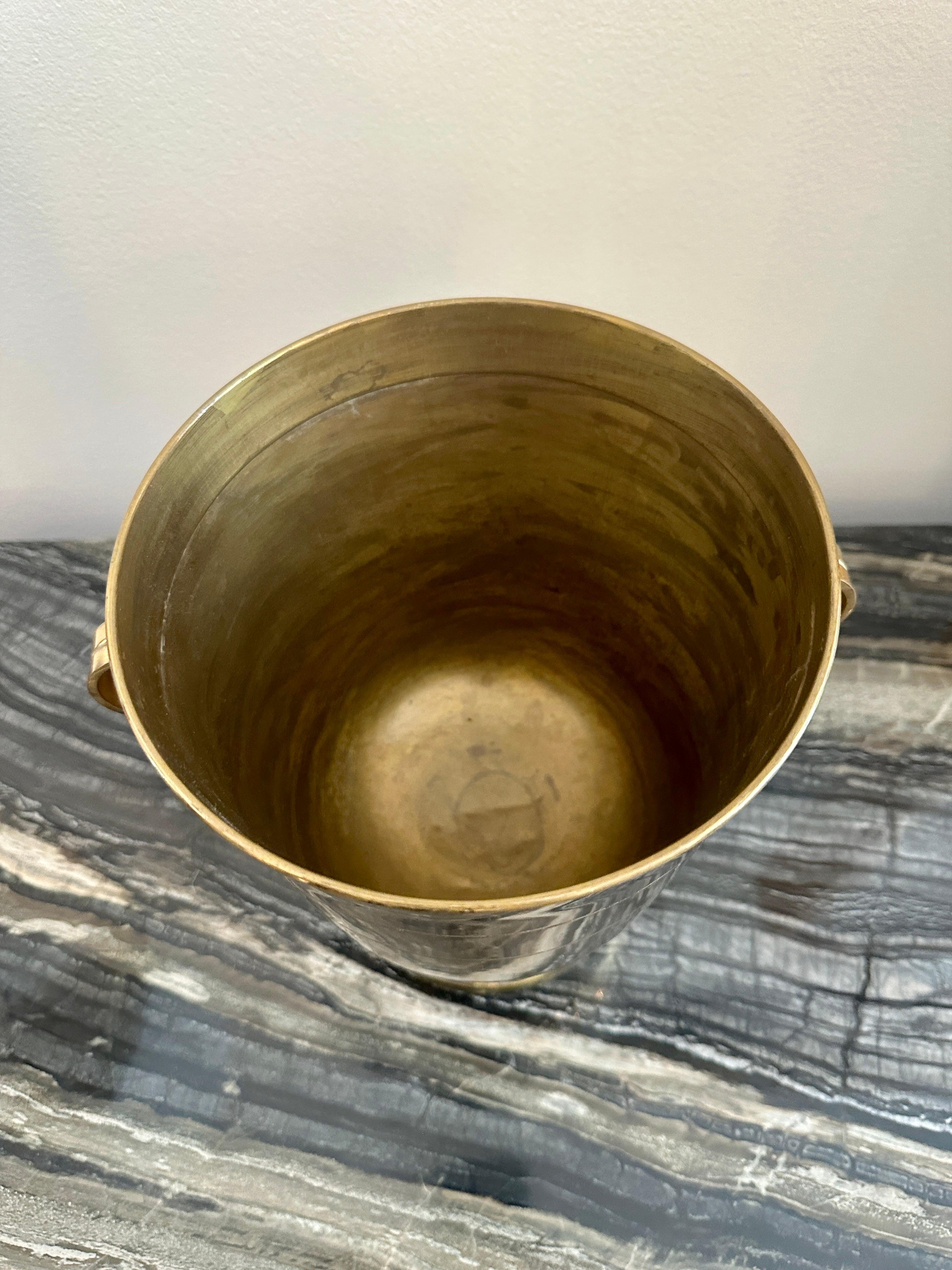 Tommi Parzinger Champagne Cooler/ Ice Bucket for Dorlyn Silversmiths. Solid brass in original condition. The original patina has a gold plating with light signs of use, some light surface scuffs to brass.  THIS ITEM IS LOCATED AND WILL SHIP FROM OUR