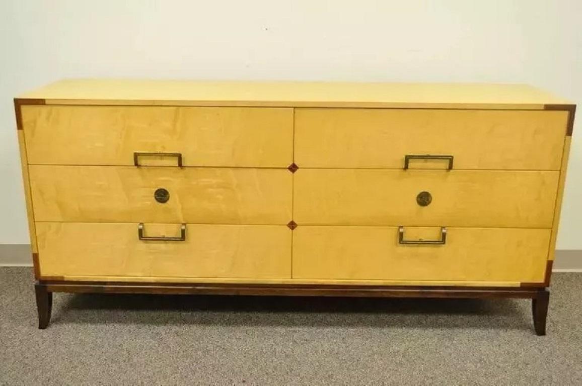 Tommi Parzinger for Parzinger Originals Maple & Mahogany Dresser Chest Credenza. Item features six dovetail constructed drawers, mahogany plinth, brass Parzinger hardware and inlaid mahogany accents. Circa Mid 20th Century. Measurements: 33