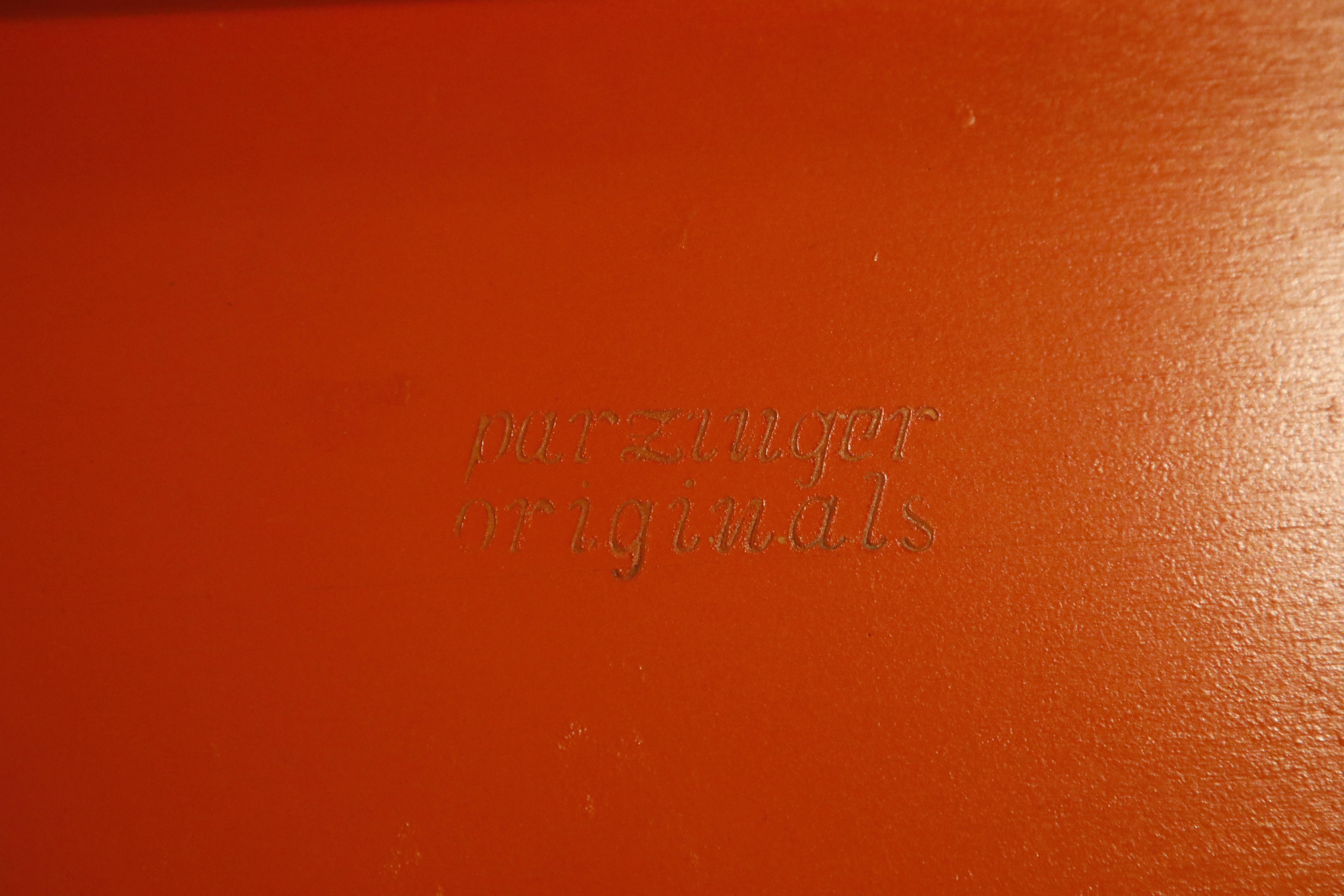 A very rare, highly sought after and collectible pair of 1960s Tommi Parzinger for Parzinger originals (signed under both tables) lacquered orange Parsons coffee tables. Did we mention these are both signed? Tommi Parzinger has such a strong