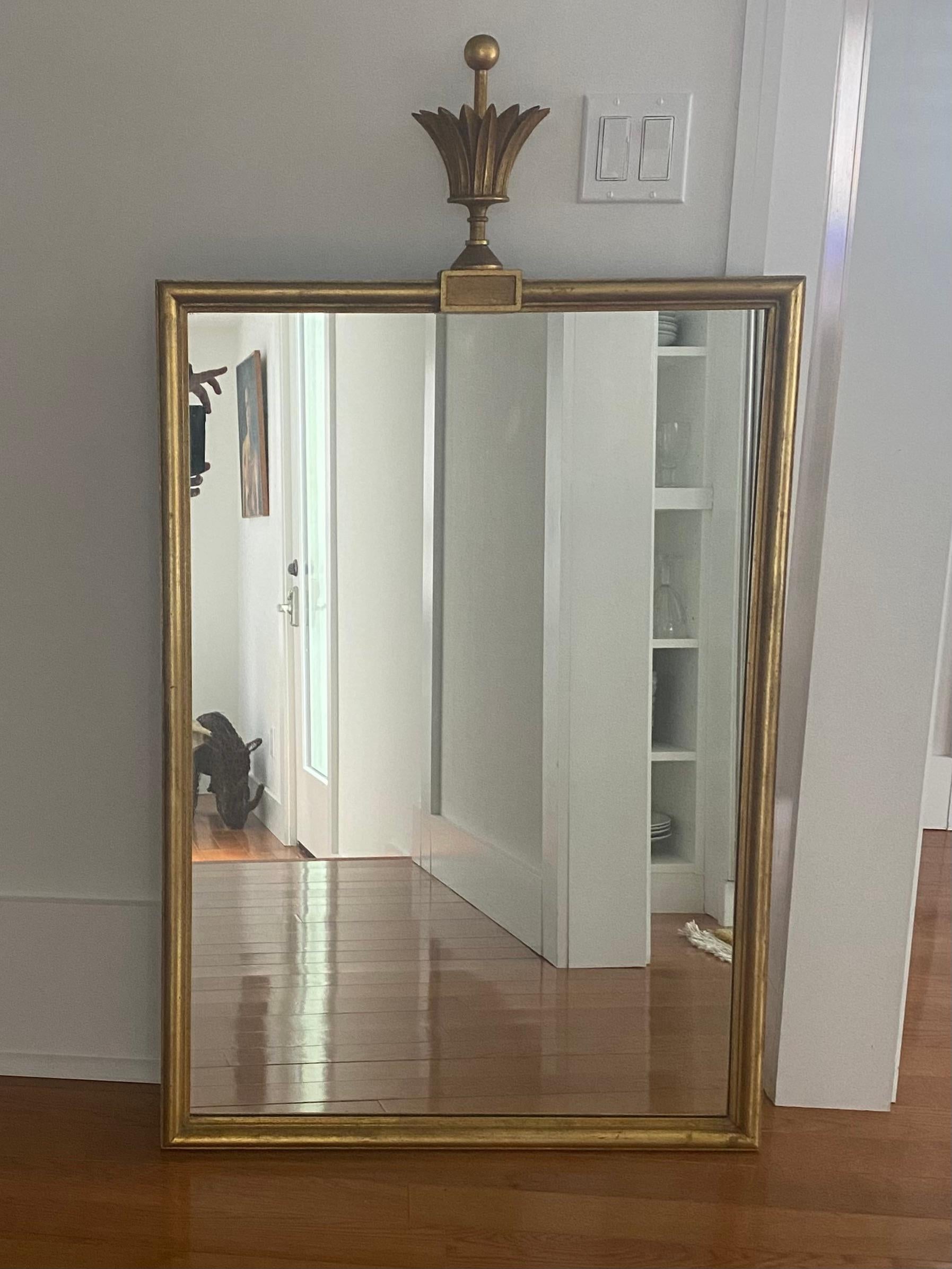Tommi Parzinger rectangular mirror with crown finial.
Labeled on back with D. Milch and Son Inc.
approximately 28 x 40 inches plus 10 inch finial.