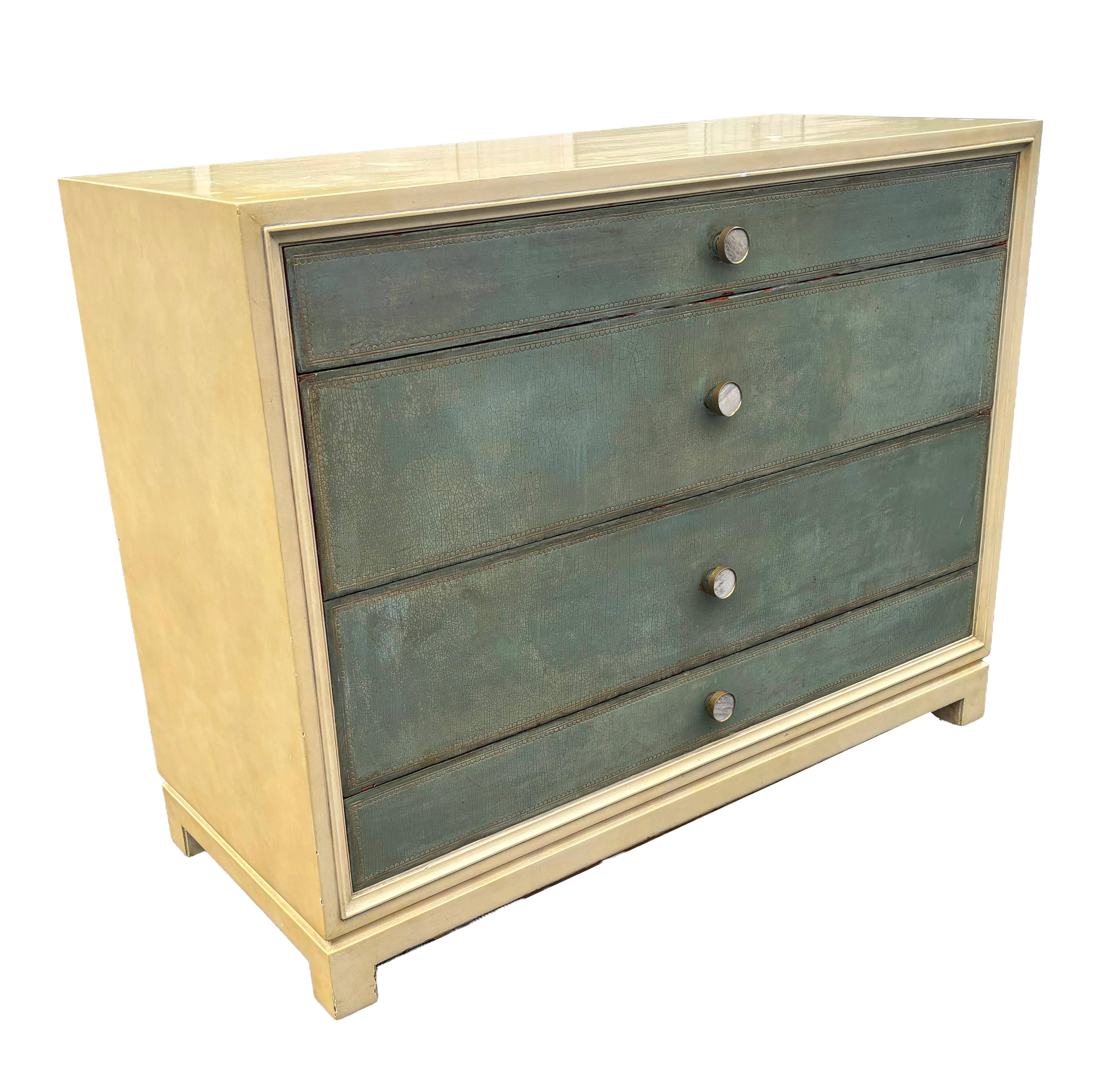 Rectangular with the case lacquered to imitate vellum. Three drawers with leather and glazed surface. Mother of Pearl knobs. Signed 