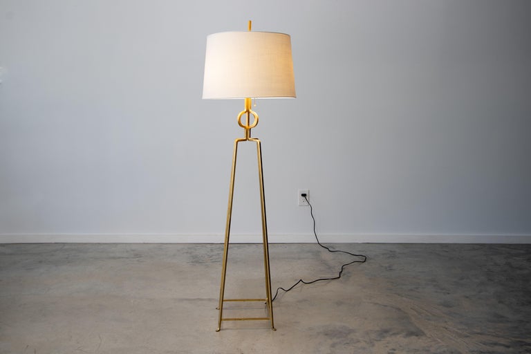 Tommi Parzinger, American/German (1903-1981).

Tommi Parzinger floor lamp with tapered gilt enameled iron frame, dual light sockets.

Dimensions:

Measures 56.5