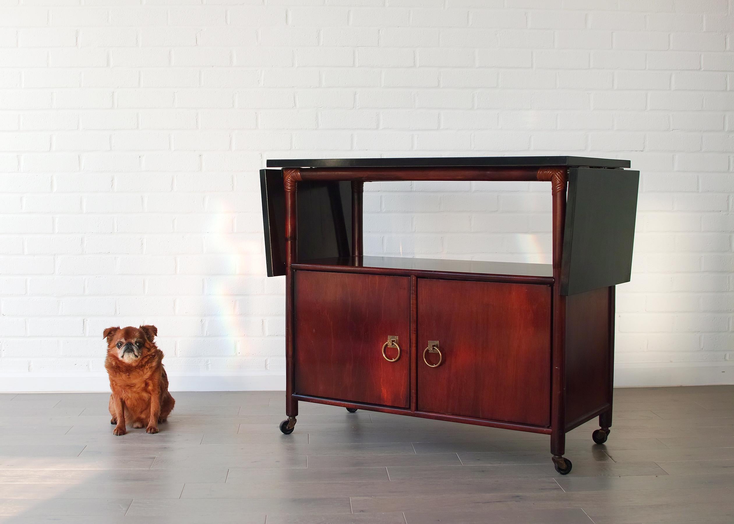 Cabinet by Henry Olko for Willow & Reed featuring signature hardware by Tommi Parzinger for Willow & Reed. Two-drop down leaves extend length to 59