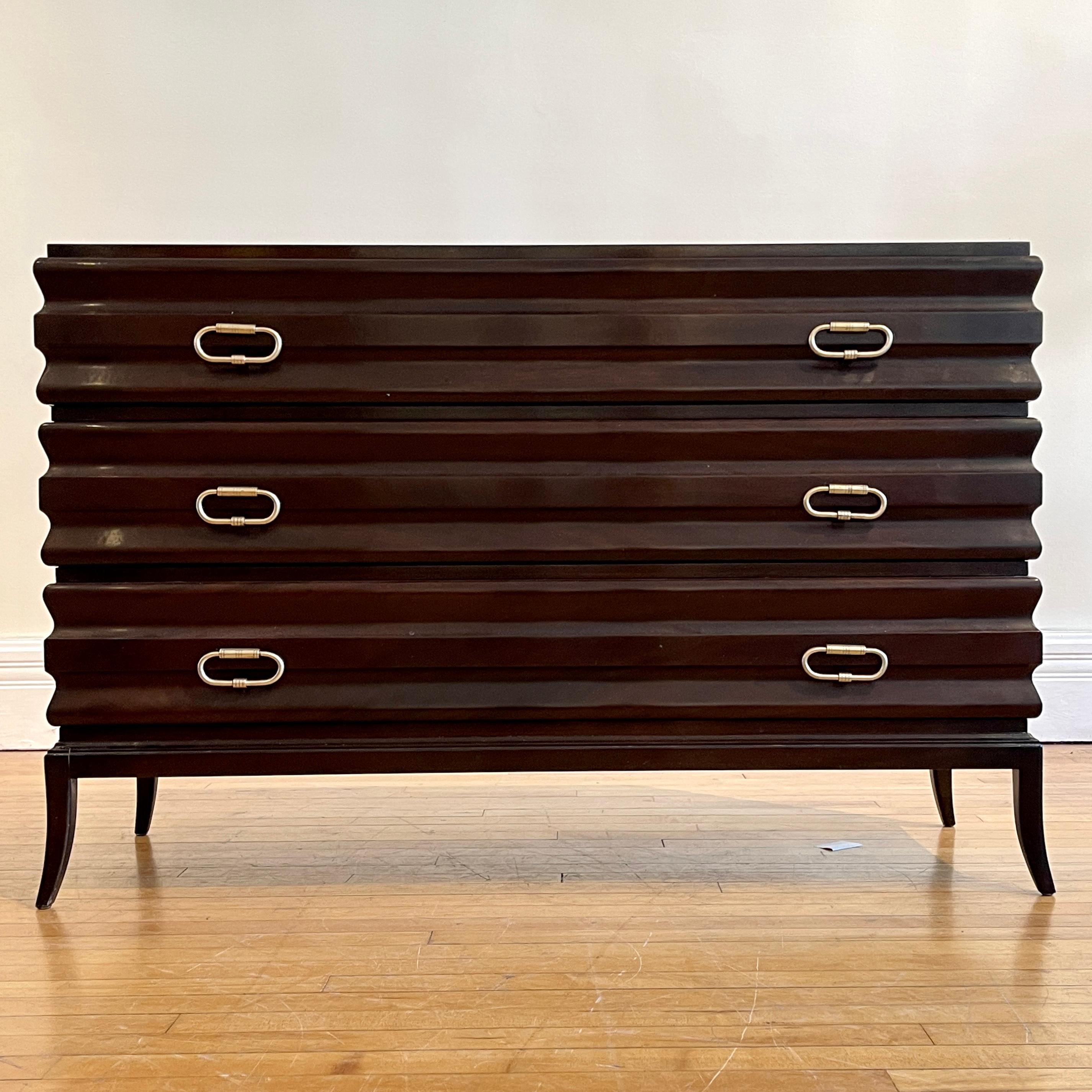 This is a rare Tommi Parzinger / John Cameron fluted commode with incised brass handles from the 2000s. This line was the brainchild of Patricia Palumbo in collaboration with Parzinger's partner John Cameron. As quoted by Cameron in a 2010