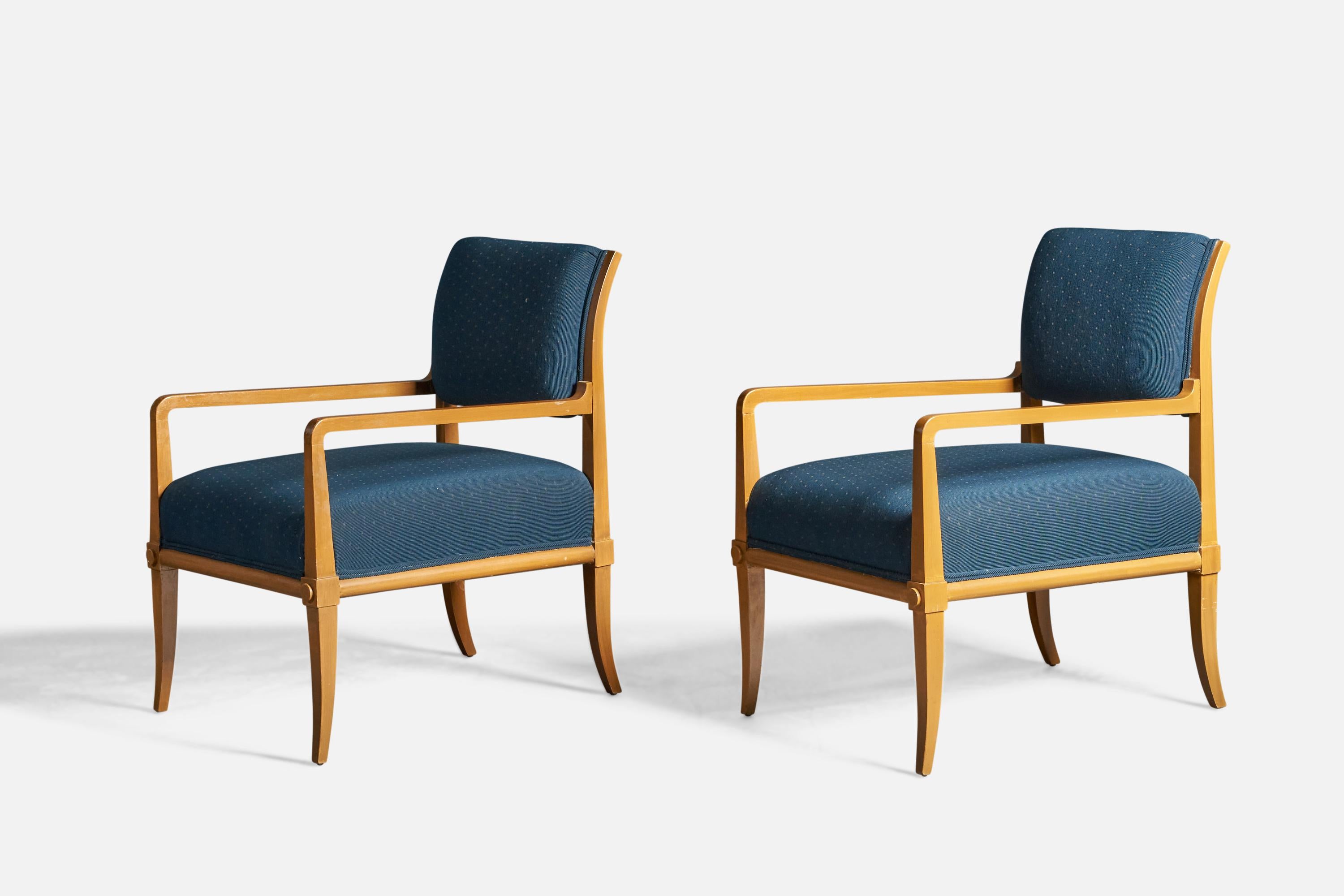 A pair of wood and blue fabric lounge chairs, designed by Tommi Parzinger and produced by Parzinger Originals, USA, 1950s.