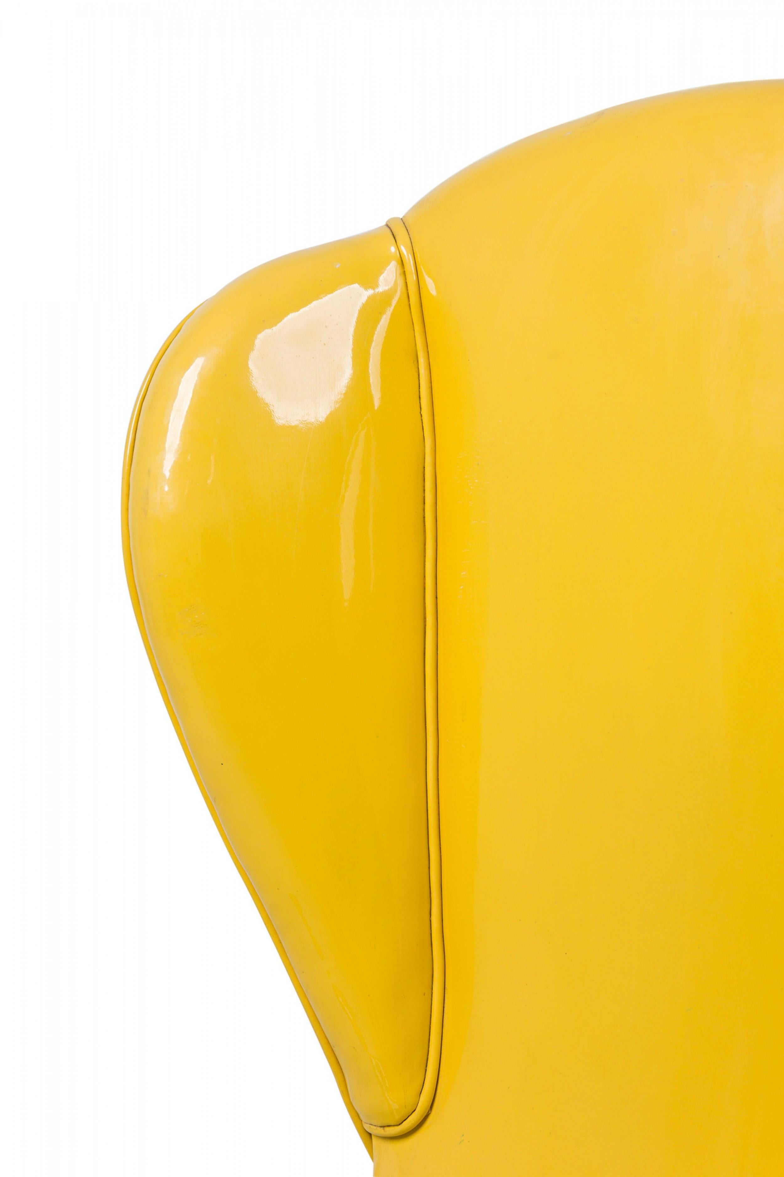 Tommi Parzinger Midcentury American Yellow Vinyl Upholstered Wing Chair In Good Condition For Sale In Queens, NY