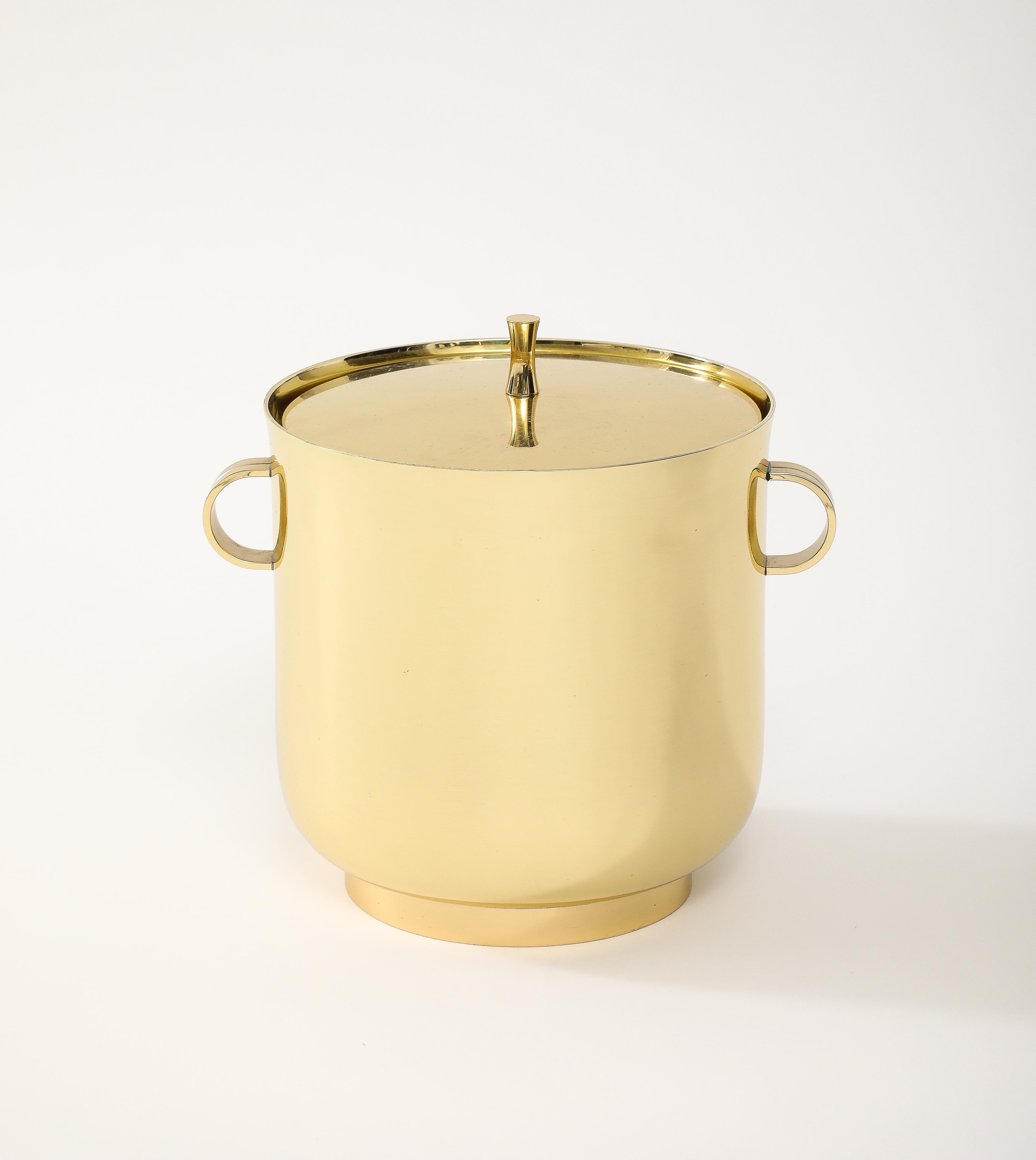 Modernist brass ice bucket with a mercury glass liner designed ny Tommi Parzinger for Dorlyn. Professionally polished and lacquered.
