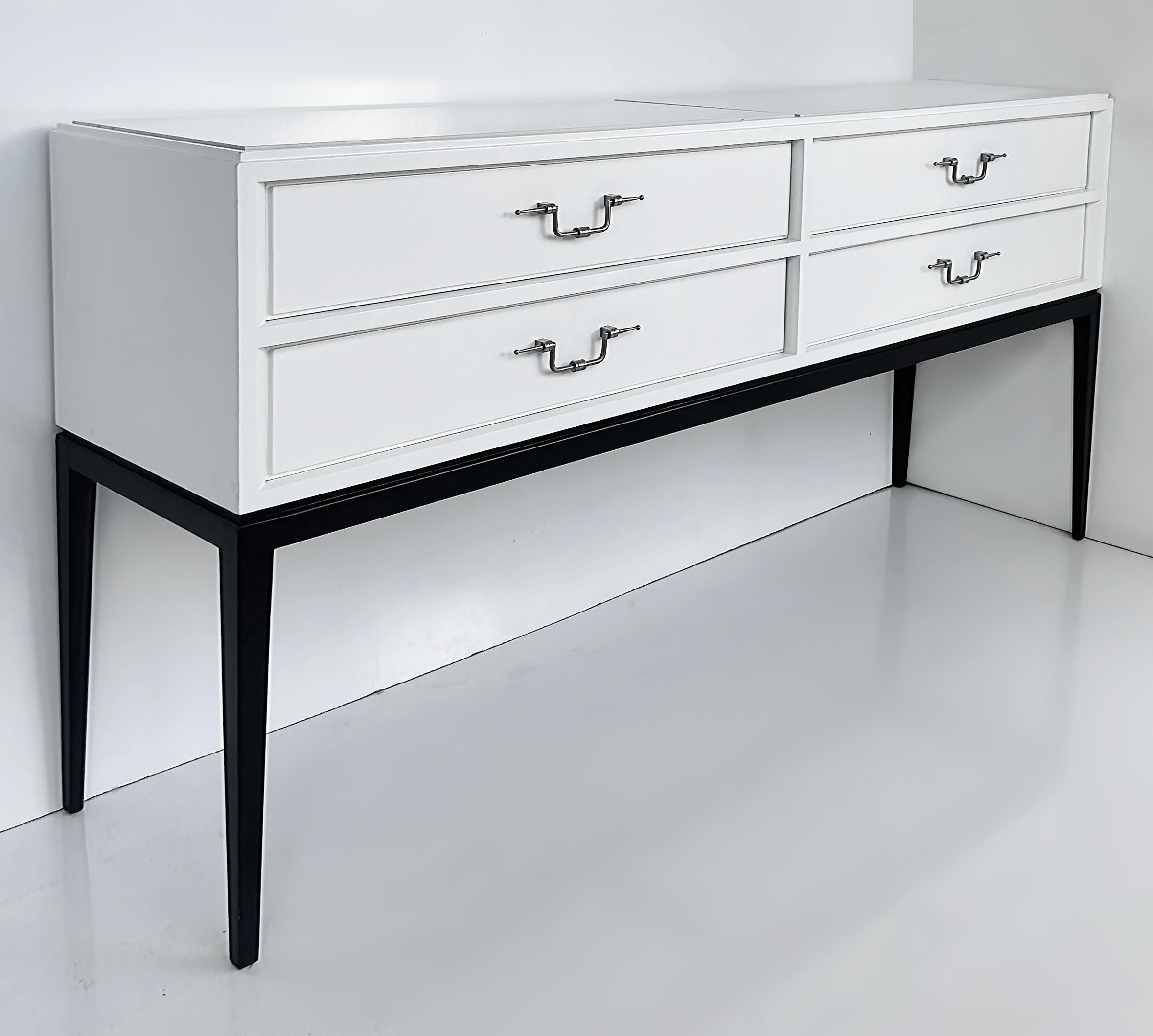 Tommi Parzinger Originals 4-Drawer Lacquered Console Credenza

Offered for sale is an original white lacquered four-drawer console credenda from Tommi Parzinger.  This piece is part of the estate of a socialite who was friends with Parzinger and had