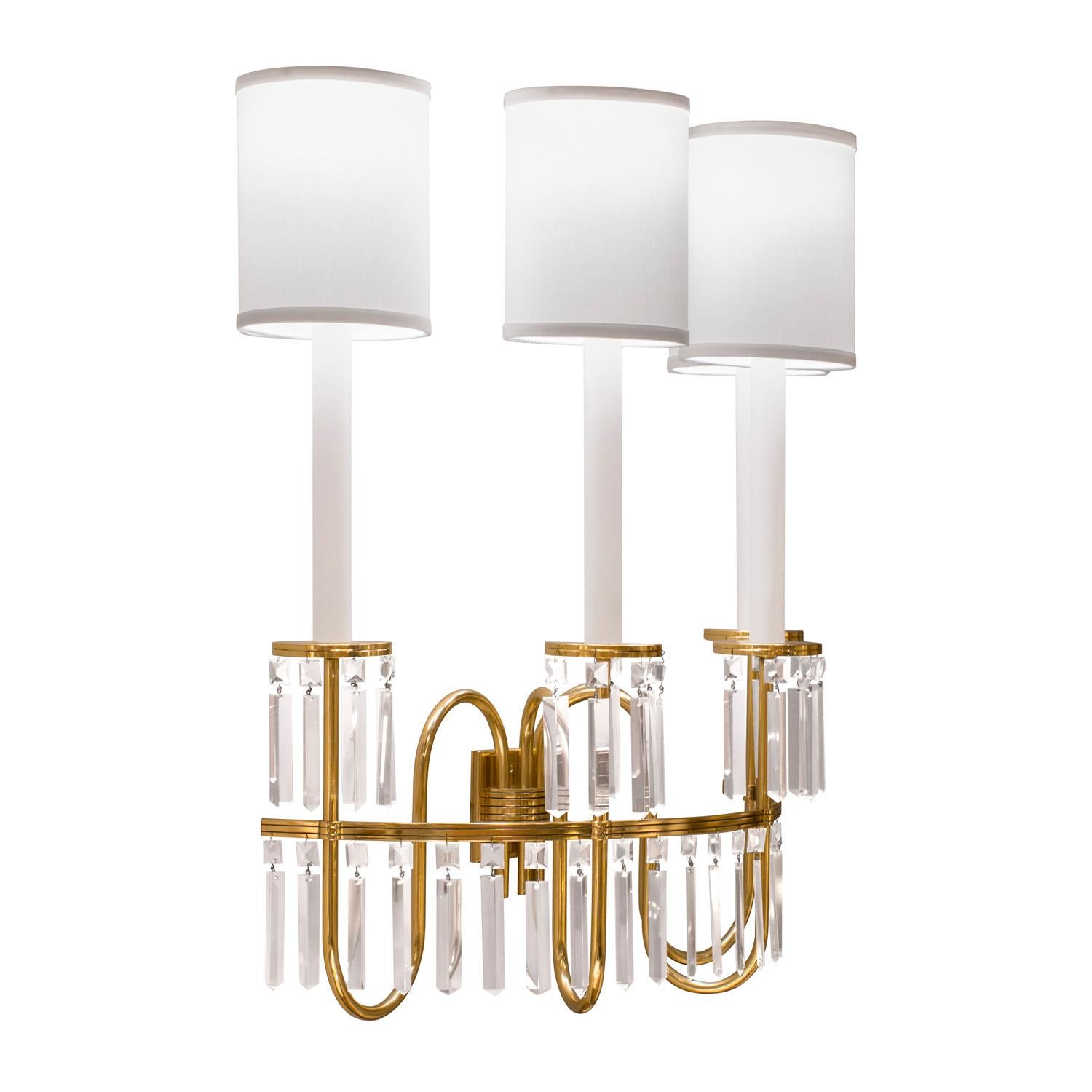 Pair of rare and important large sconces in polished brass with iconic engraved elements and adorned with faceted crystals by Tommi Parzinger for Parzinger Originals, American 1950's.  These incredible sconces were made by Parzinger as a custom