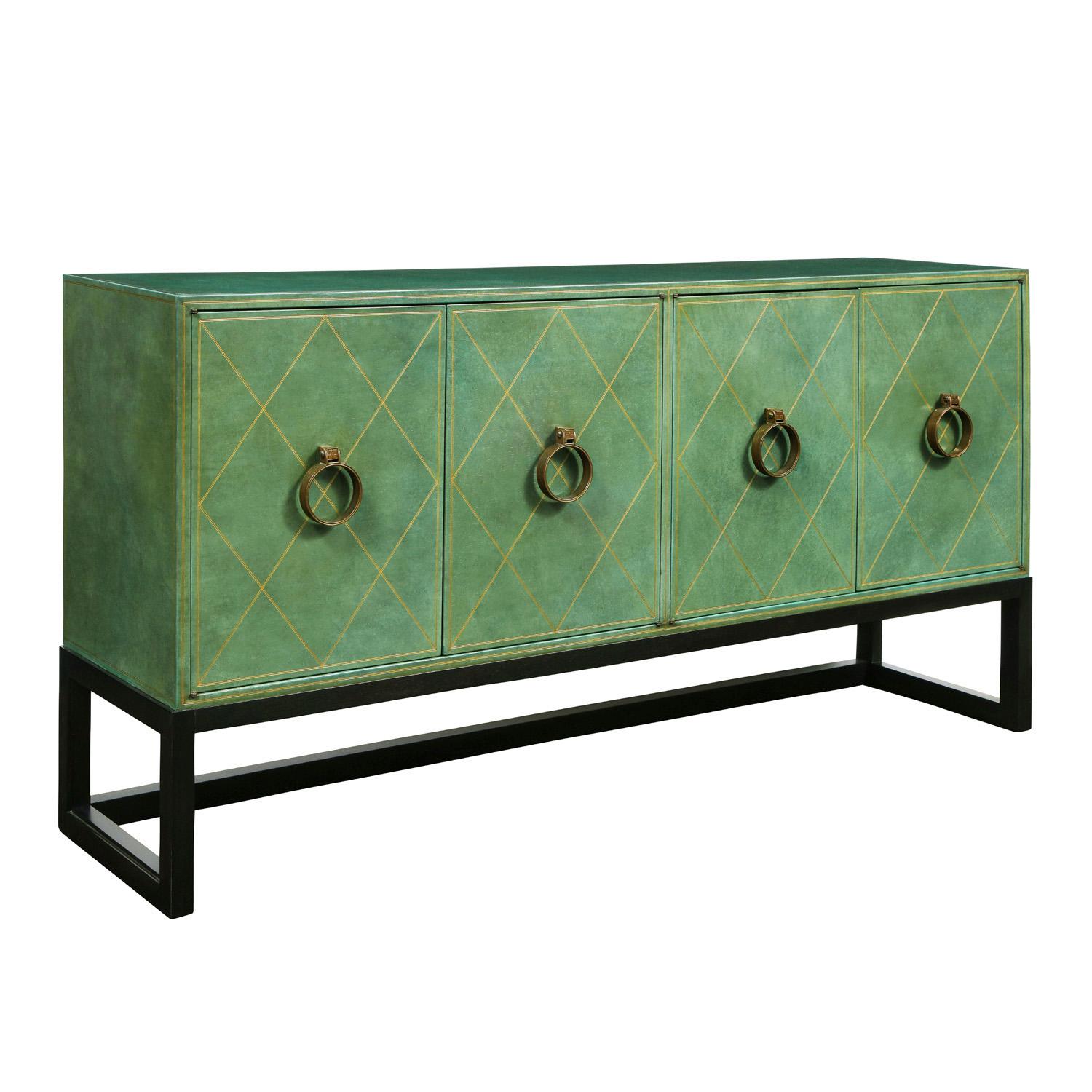 Beautifully crafted 4 door commode model TP-18 covered in hand-tooled emerald green leather with solid bronze handles on a dark mahogany base by Tommi Parzinger for Charak Modern American 1940's. The interior is lacquered pink. This is a rare and