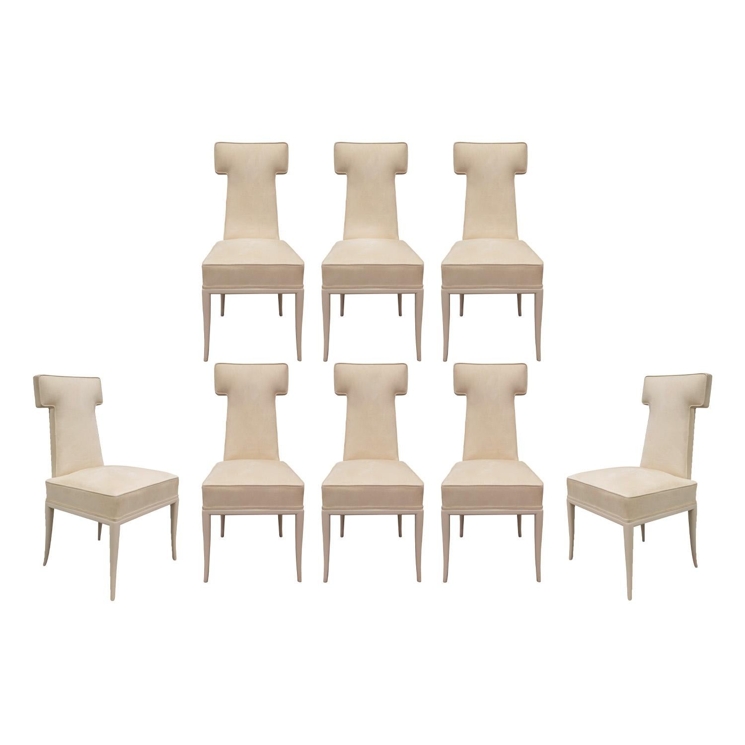 Rare and exceptional set of 8 dining chairs model 314 with base in ivory lacquered mahogany with upholstered seats and backs in cream ultrasuede by Tommi Parzinger for Parzinger Original, American 1979.  This design was a special order and is so