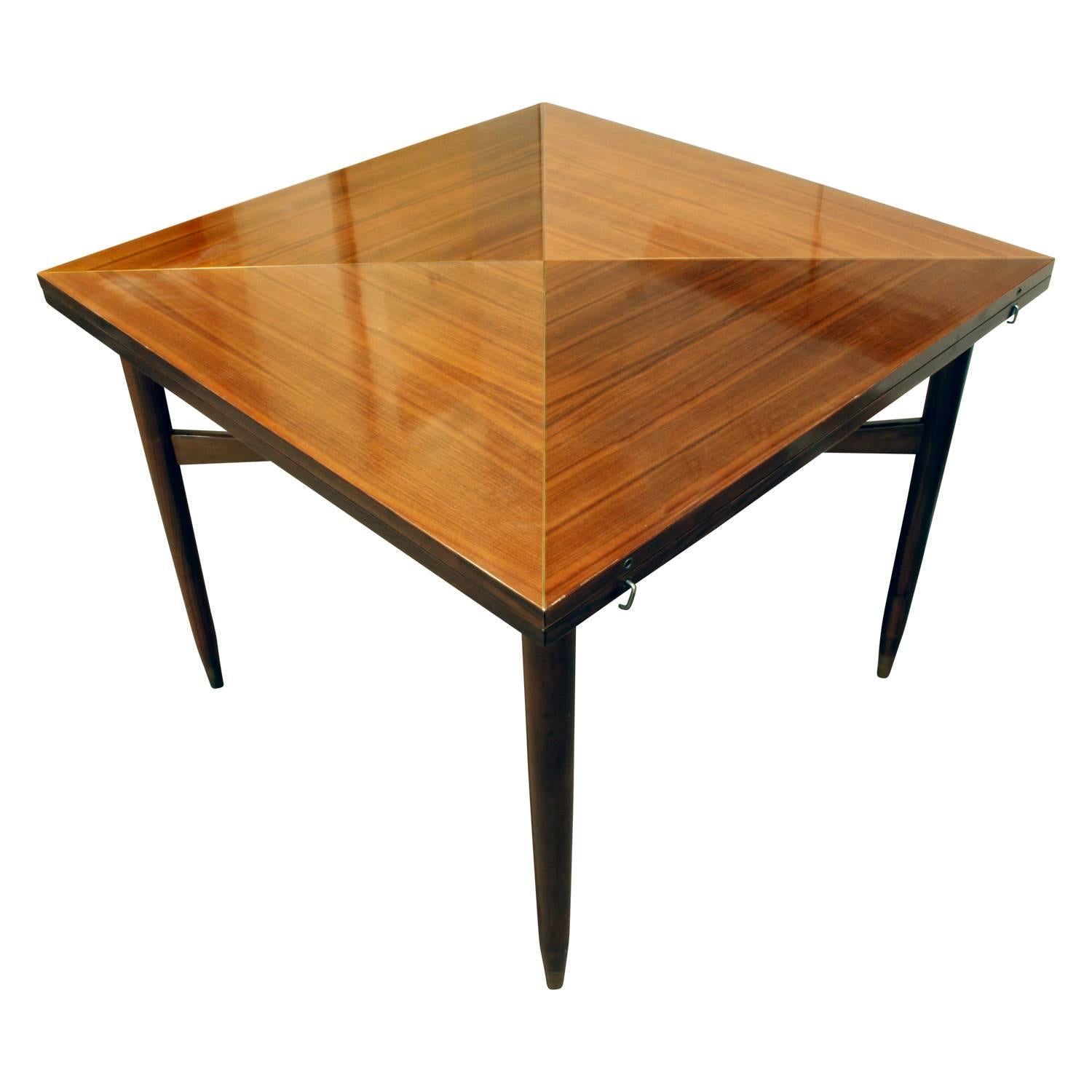 Rare flip-top game table in mahogany with brass inlays by Tommi Pariznger for Parzinger Originals, American, 1950s. This table is 72 inches wide when open.