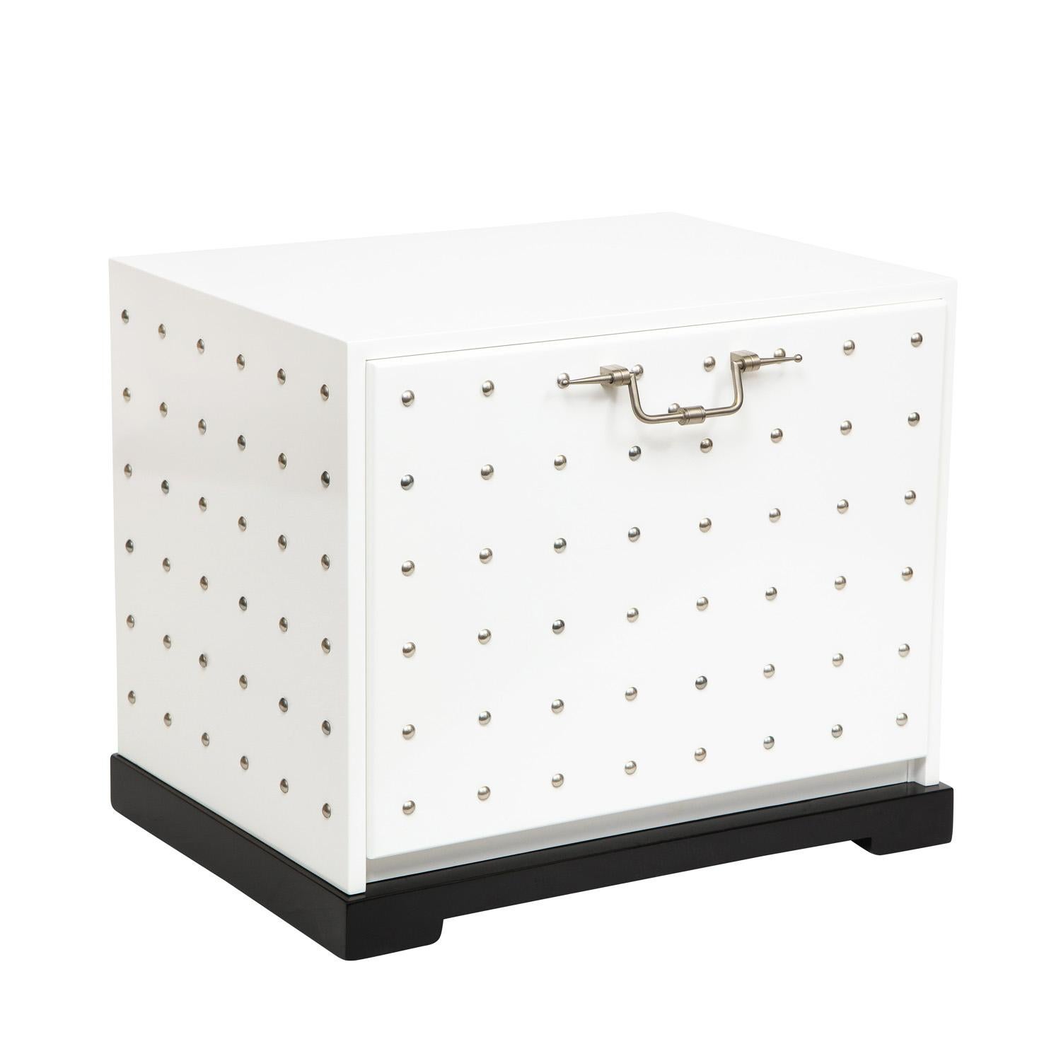 Stunning rare side table/chest model 223 in white lacquer with chrome studs and pull by Tommi Parzinger for Parzinger Originals, American 1960's (Signed “Parzinger Originals” on inside of drawer). This piece has been newly relacquered by Lobel