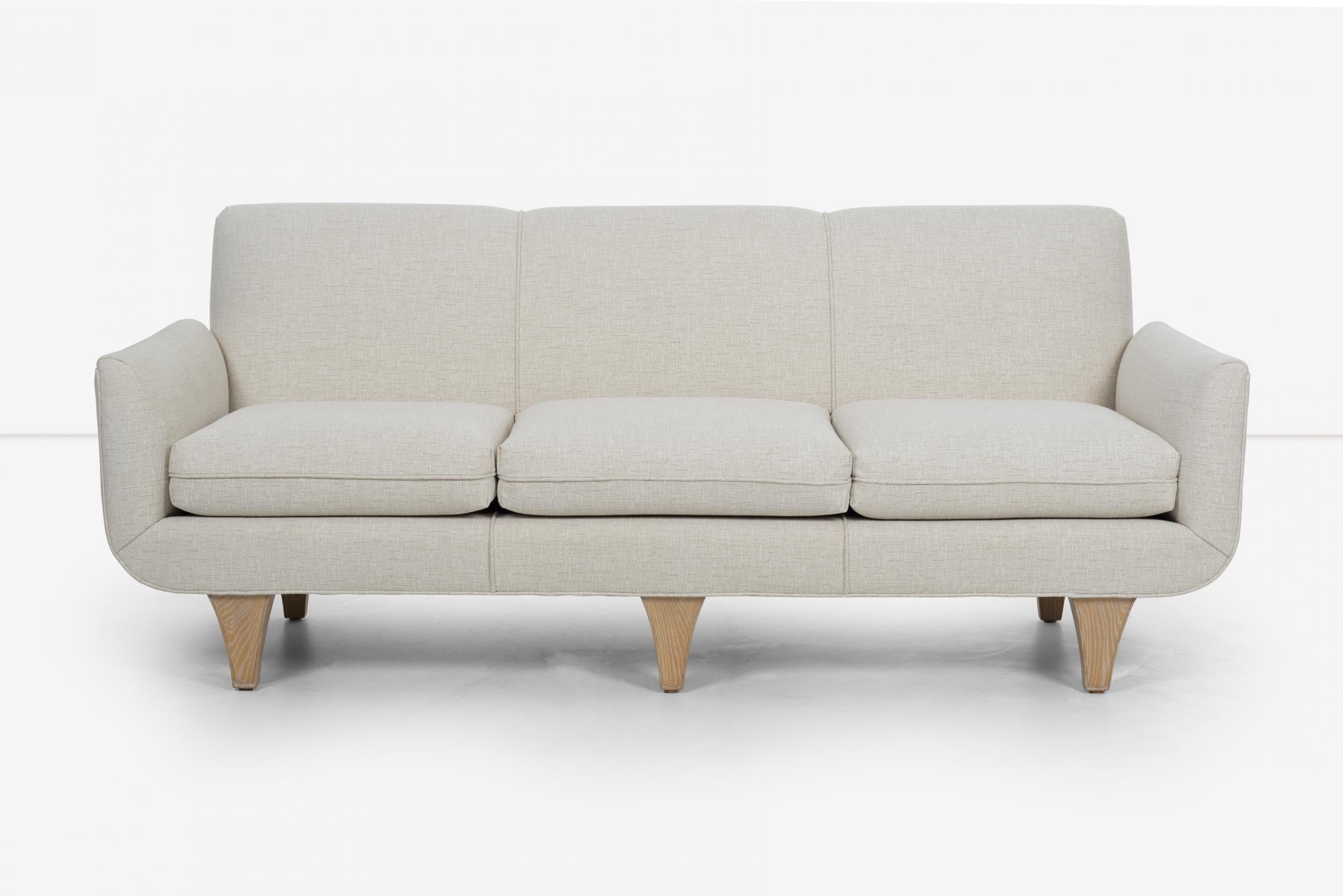 Tommi Parzinger sofa for Parzinger Originals, ceruse oak solid legs, fully restored and reupholstered with great plains cotton-poly.