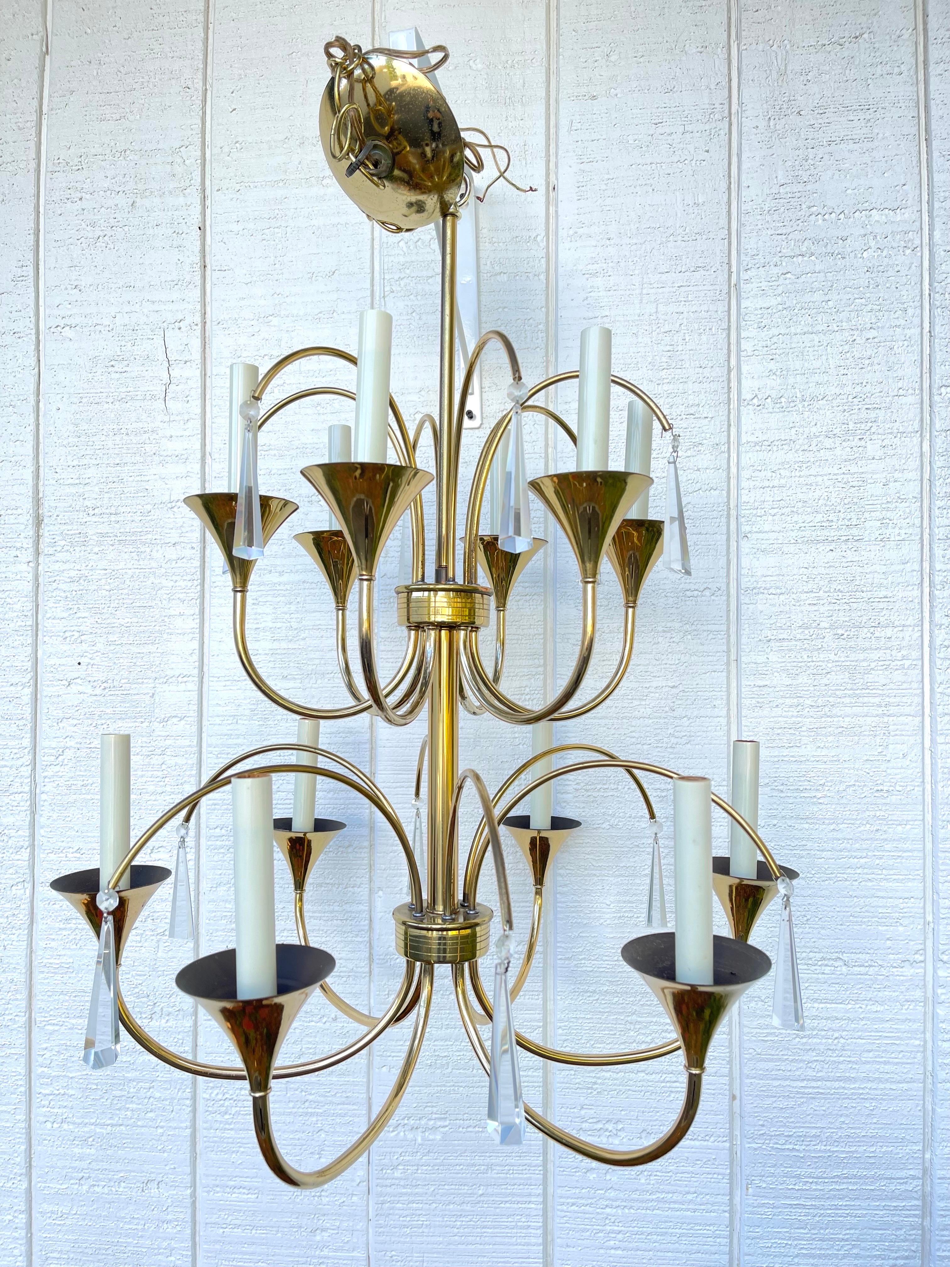 Tommi Parzinger Style Brass and Lucite Chandelier. Magnificent 12 light chandelier with full on  Hollywood Glam vibe. Similar in style to Gaetano Sciolari , the Italian designer.
