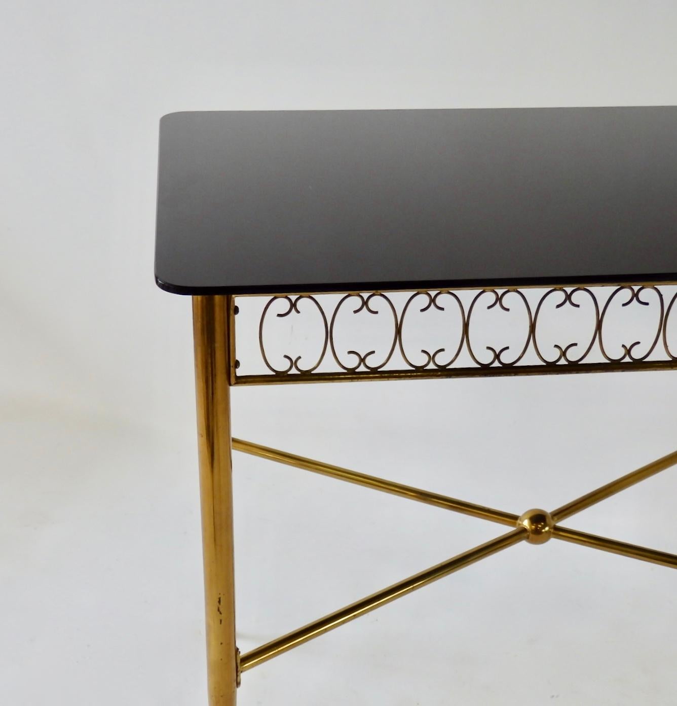 Tommi Parzinger Style Brass Base Vitrolite Glass Top Console or Entry Table In Good Condition For Sale In Ferndale, MI