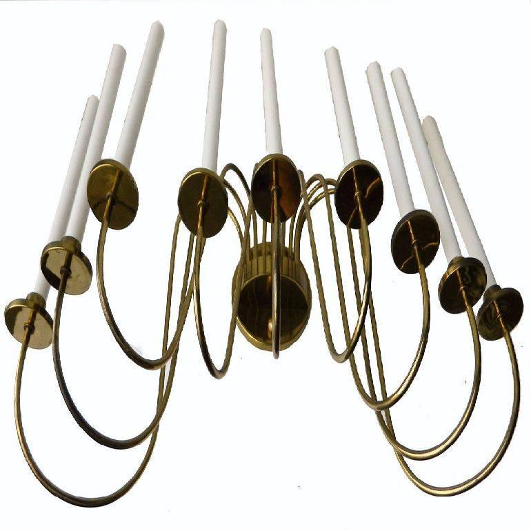 Superb huge Brass sconce, in the style of Tommi Parzinger, 9 lights 60 watts max per socket, US wired, in working condition.
Have a look on our the largest collection of French and Italian Mid-Century period sconces, more than 500 pairs.
 