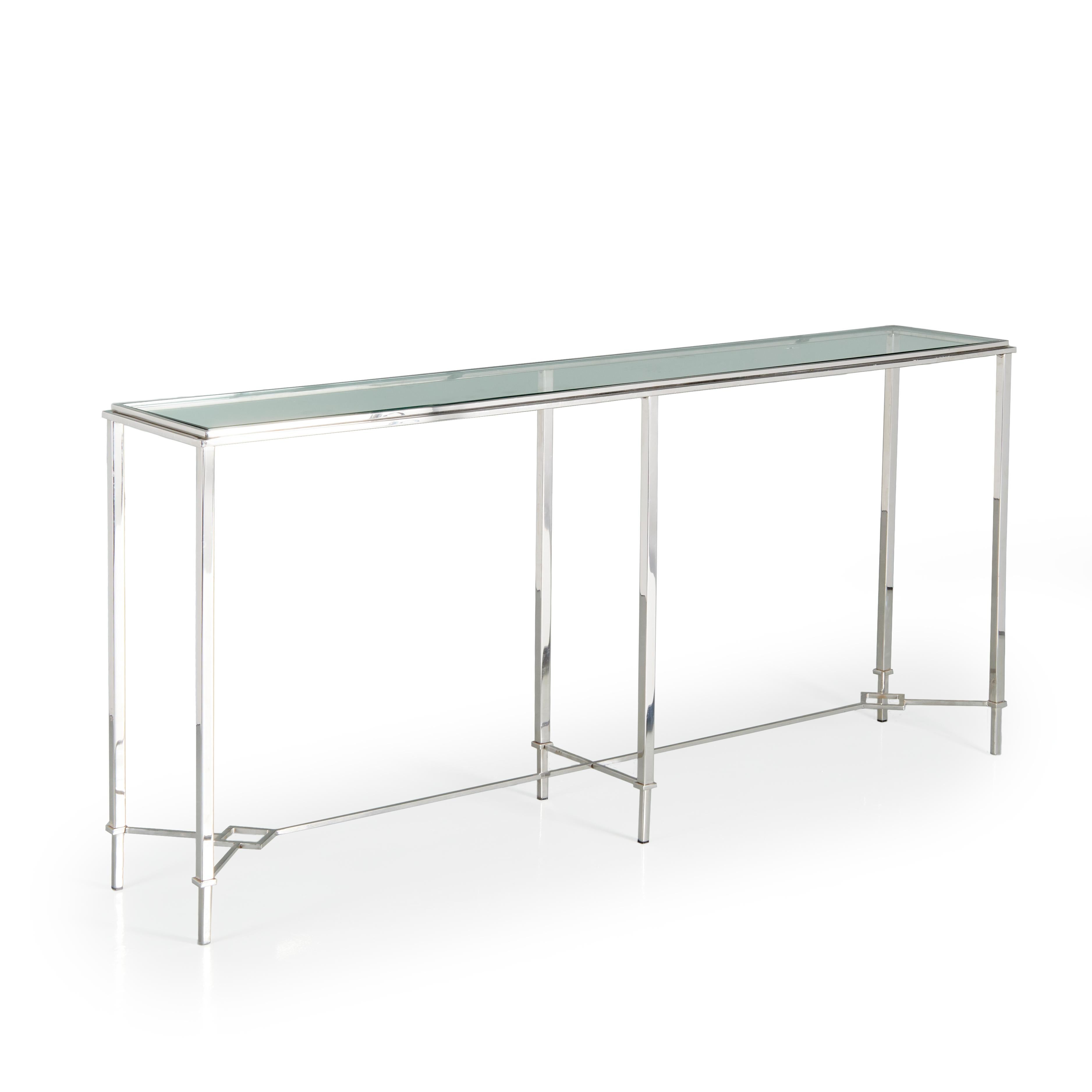 Elegant streamlined console table with polished chrome square tube metal frame and thick green plate glass top. High quality construction with polished welds, and tapering legs joined by stretcher set with diamond shaped connectors. 

Attributed to