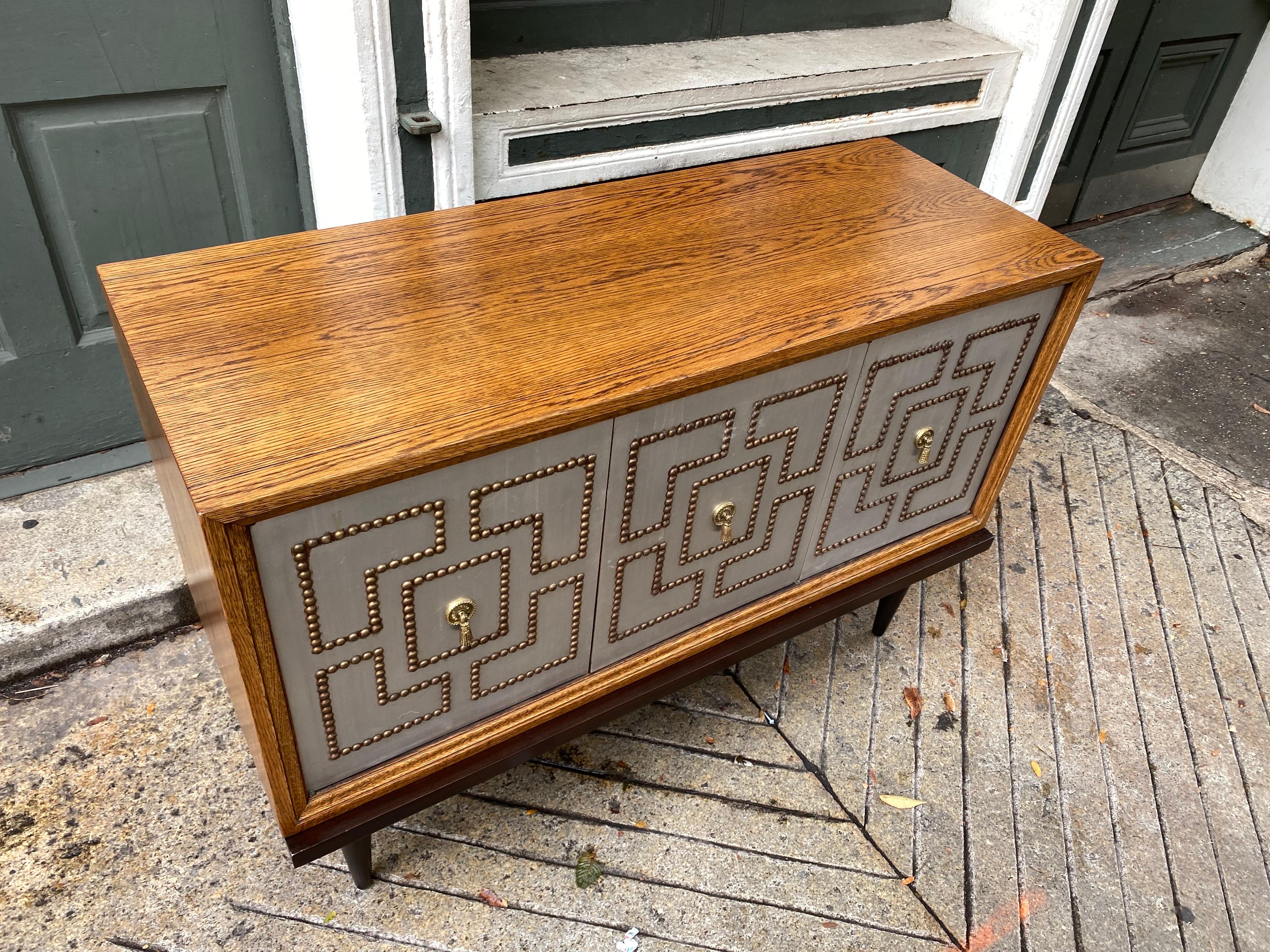 American Tommi Parzinger Style Studded Front 3 Door Credenza on Bench For Sale