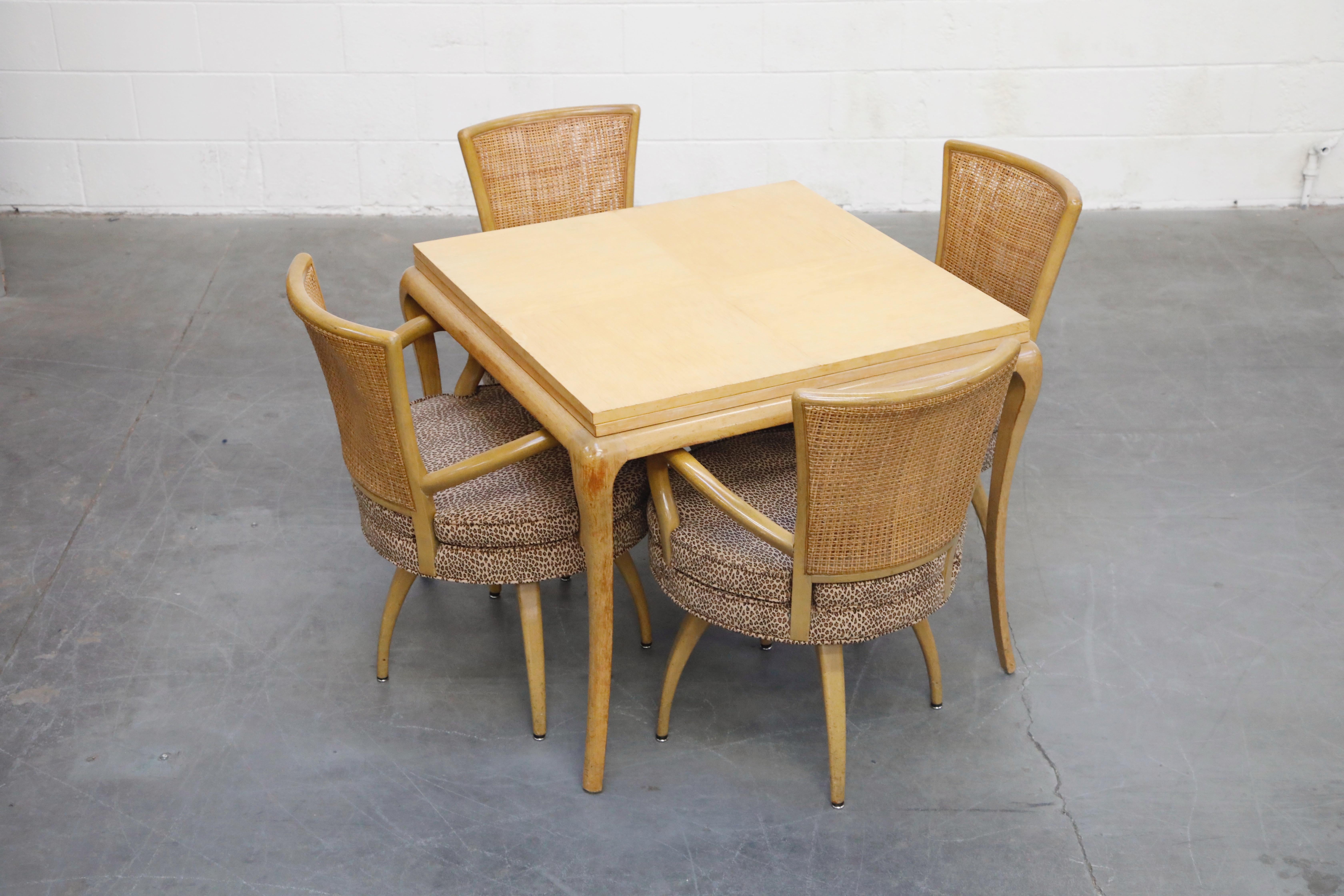 This incredibly attractive set of 1950s Mid-Century Modern swivel dining armchairs and expandable dining table is in the style and of the period of Tommi Parzinger for Parzinger Originals and Charak Modern. 

The four (4) dining swivel armchairs