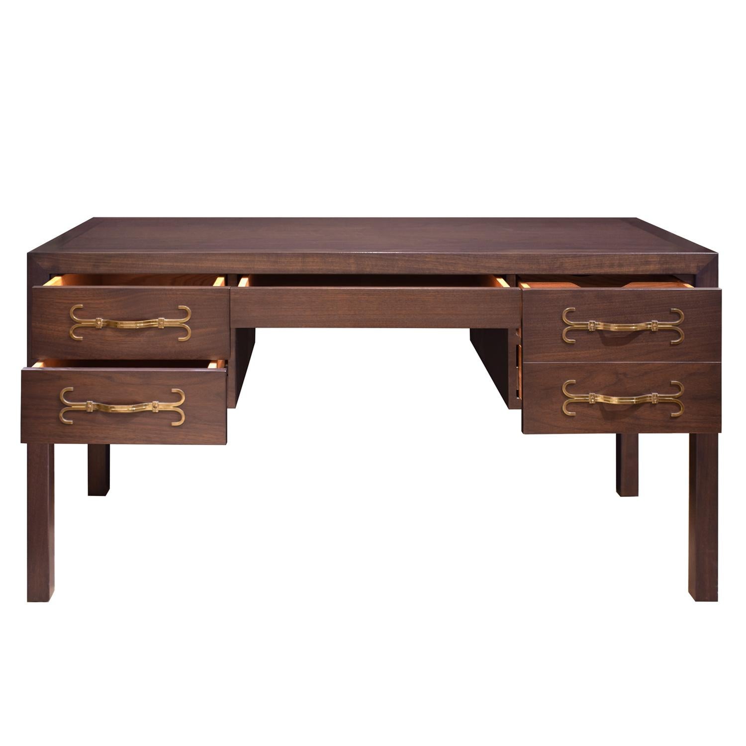 Fine desk in dark walnut with ebonized satinwood inlays on top and exquisite etched brass hardware on drawers by Tommi Parzinger for Parzinger Originals, American 1960's (branded signature in drawer reads “Parzinger Originals”) This was a custom