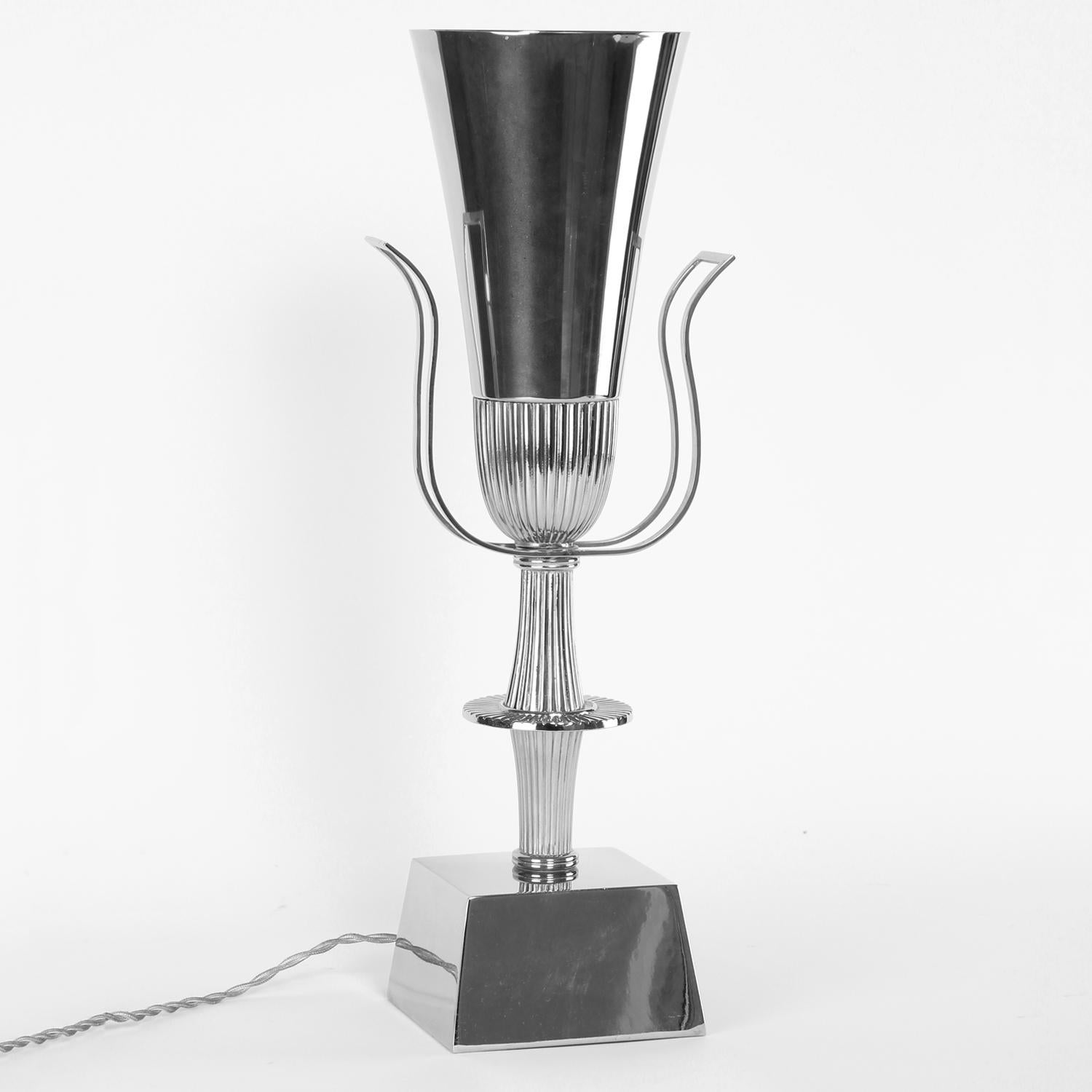 Neoclassical urn-shaped silver-plated table lamp with open back and top by Tommi Parzinger for Lightolier, Heritage Silver collection, American, 1940s.