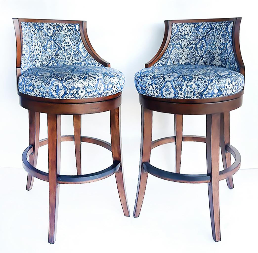 Tommy Bahama Home Ocean Club Cabana Swivel Bar Stools- Set of 6

Offered for sale is a set of six Tommy Bahama Ocean Club upholstered swivel bar height stools.  They have a great ribbed wood design on the backs. These are a recent acquisition from a