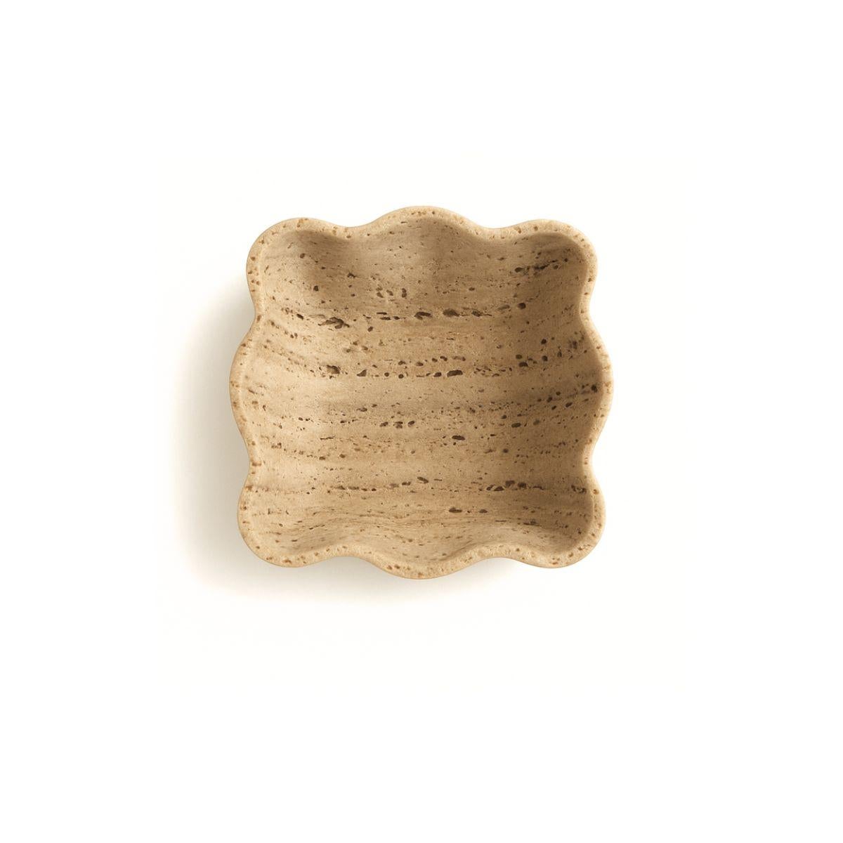 Thoughtfully crafted from solid natural travertine, this beautiful dish was designed with new moms in mind. Perfectly sized to hold your baby’s pacifiers, it brings a sense of calm, beauty, and organization to those everyday moments.

Its soft,