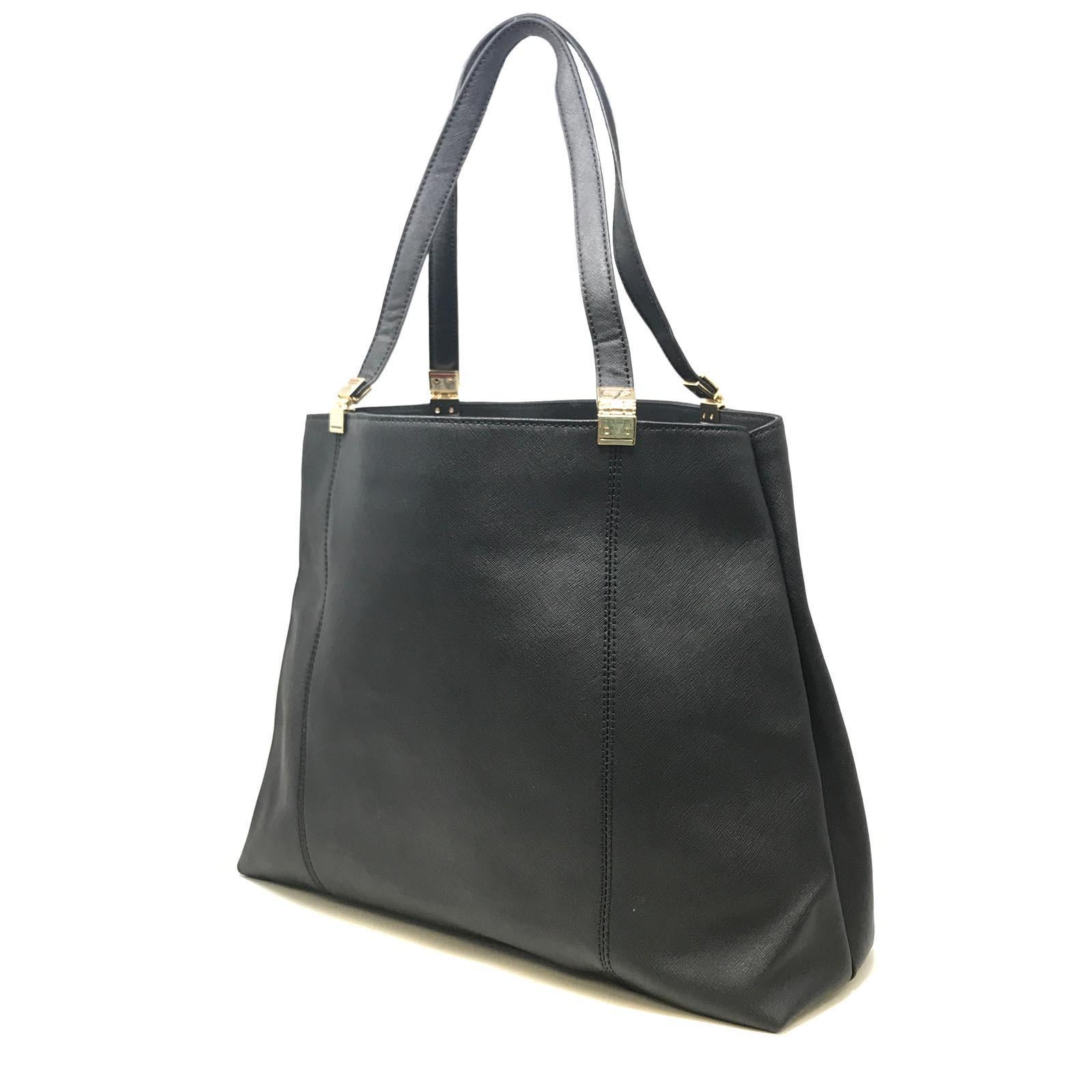 Pre Owned Tommy Hilfiger Black Large Shoulder Women's Bag is in prefect condition  except one minor defect one screw from handle is missing. length 18 inch, height 12 inch, depth 6 inch 