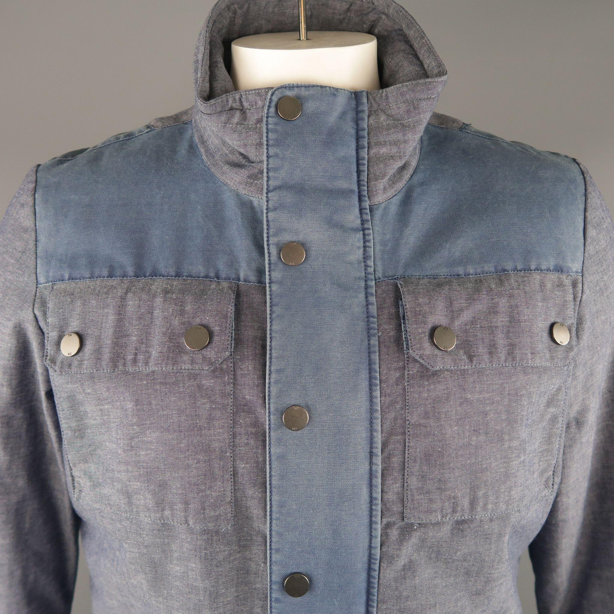 TOMMY HILFIGER jacket comes in blue tones in solid cotton / linen  material, with a high collar, patch and cargo pockets, zips and snaps.
 
Excellent Pre-Owned Condition.
Marked: M
 
Measurements:
 
Shoulder: 17.5  in.
Chest: 48  in.
Sleeve: 27 