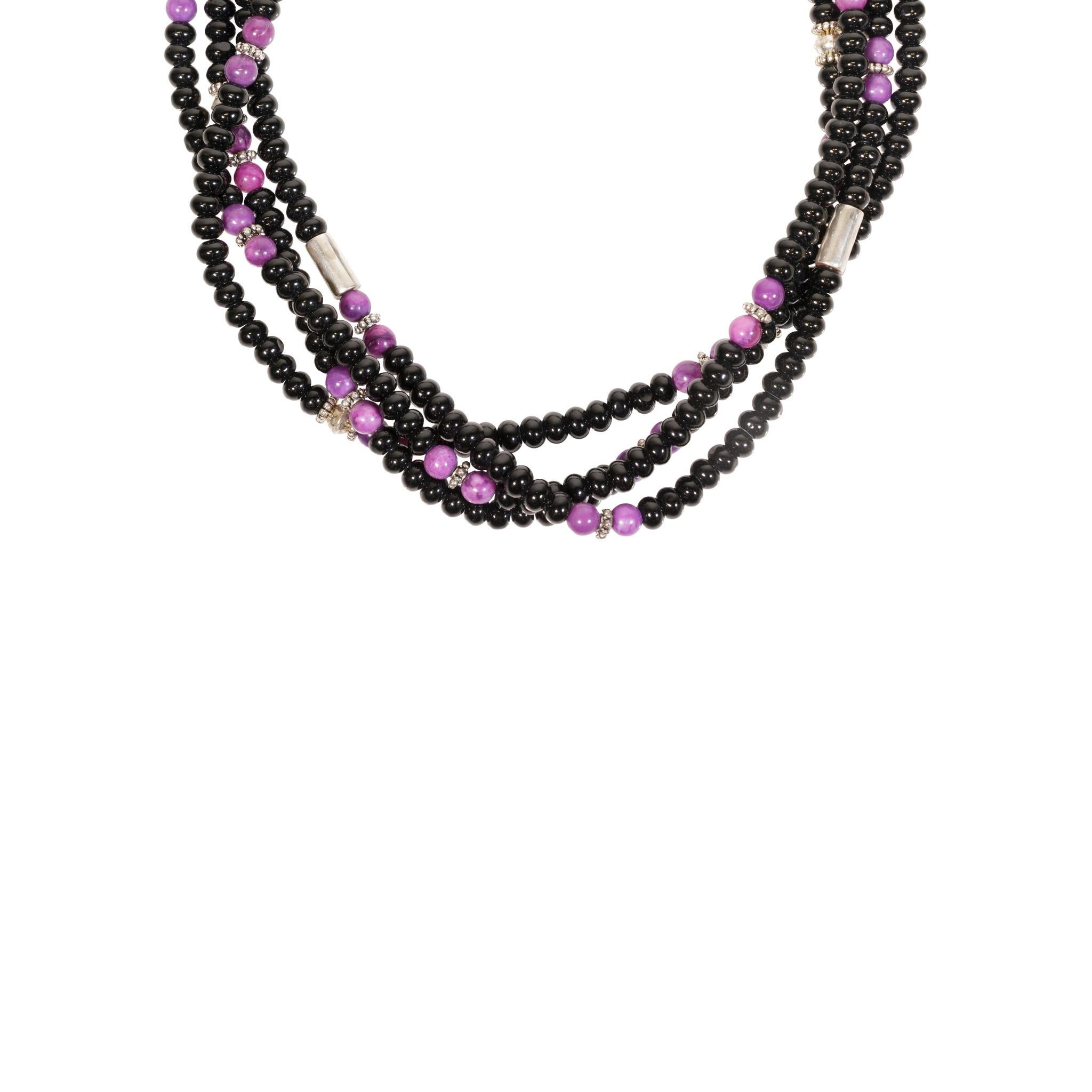 Tommy Singer navajo onyx and sugilite necklace with four strands. Silver accents with 14kt gold overlay.

PERIOD: After 1950

ORIGIN: Navajo, Southwest

SIZE: 29