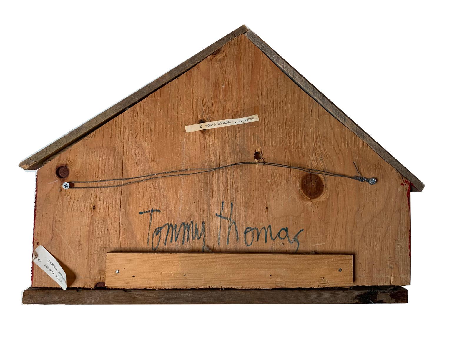A beautiful one of a kind Tom's Bodega by popular artist Mary “Tommy” Thomas. She was born and raised in Saugus, Massachusetts. After her parents divorced, she followed her mother to New York City where, “after a stint in secretarial school and a